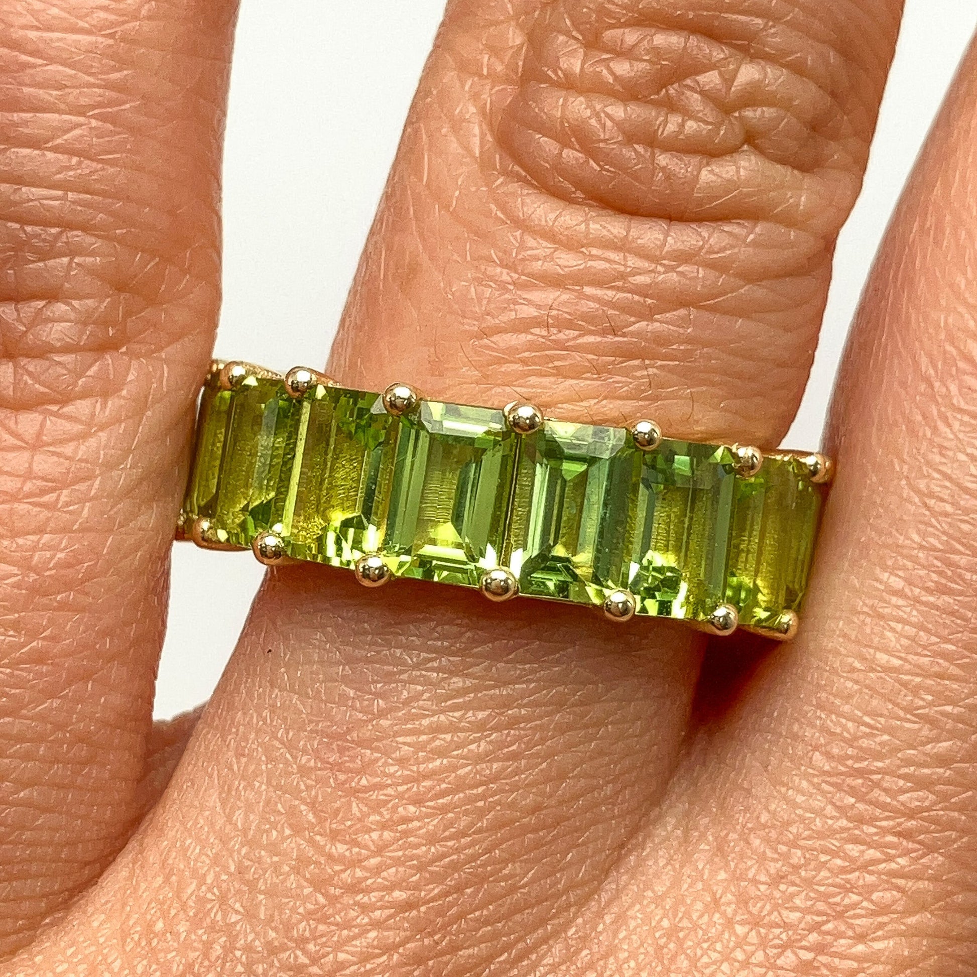 9.72cts Peridot Emerald Cut Eternity Band, 18k - Forever Rox Fine Jewelry