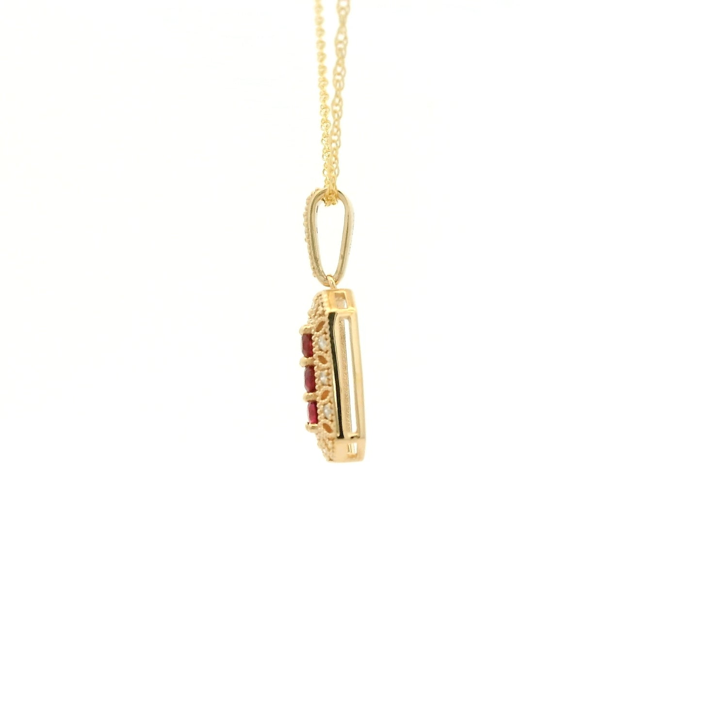 Yellow Gold Pendant with 3 prong set round cut natural Rubies in the center filigree design and diamonds at Forever Rox Fine Jewelry, Lake Tahoes Best Jewelry Store
