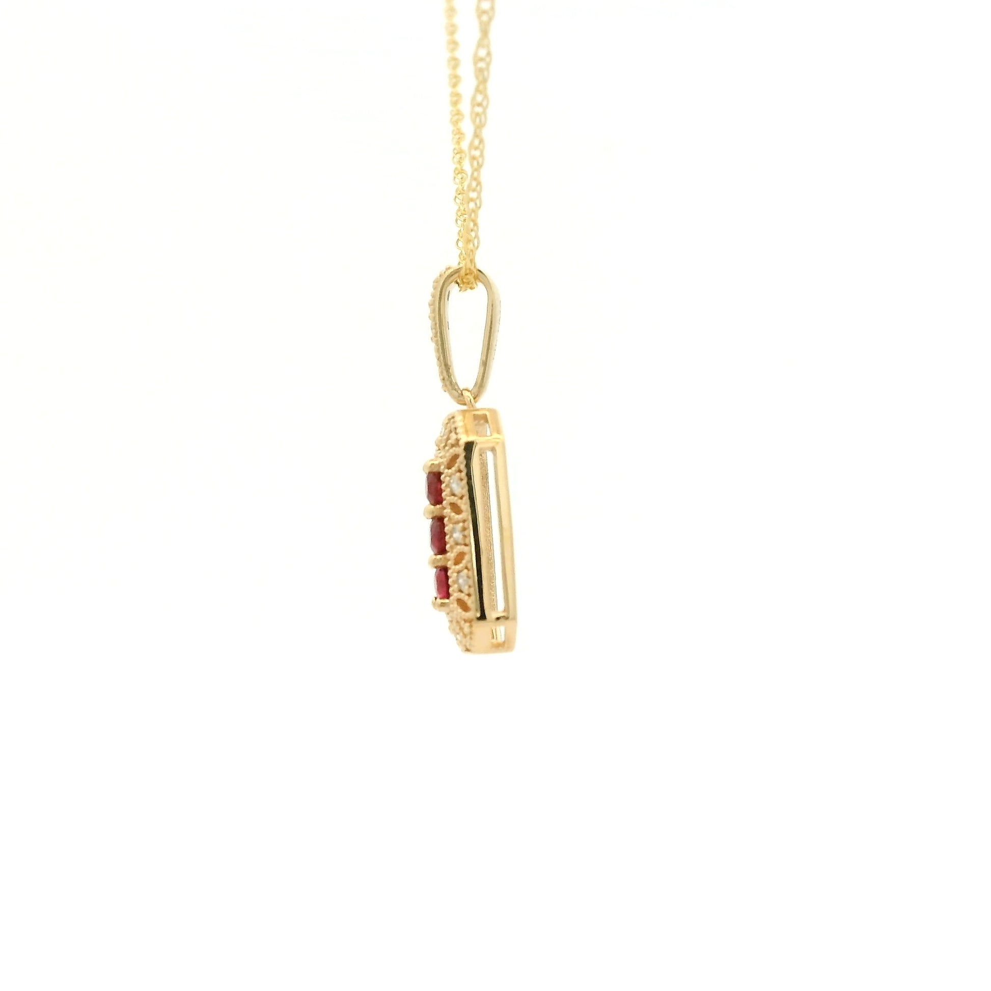 Yellow Gold Pendant with 3 prong set round cut natural Rubies in the center filigree design and diamonds at Forever Rox Fine Jewelry, Lake Tahoes Best Jewelry Store
