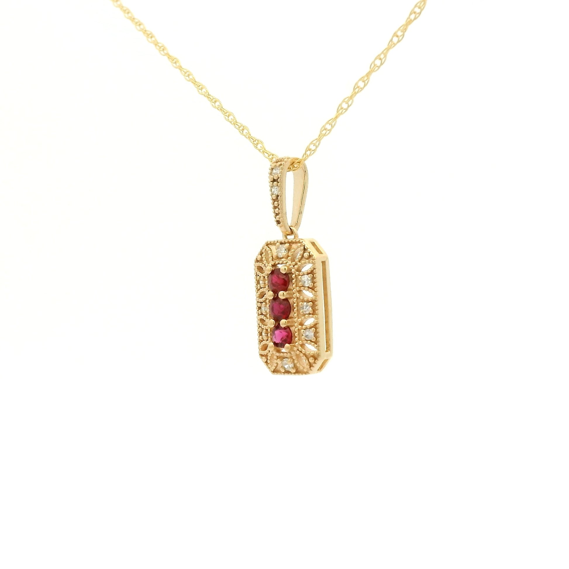Yellow Gold Pendant with 3 prong set round cut natural Rubies in the center filigree design and diamonds at Forever Rox Fine Jewelry, Lake Tahoes Best Jewelry Store
