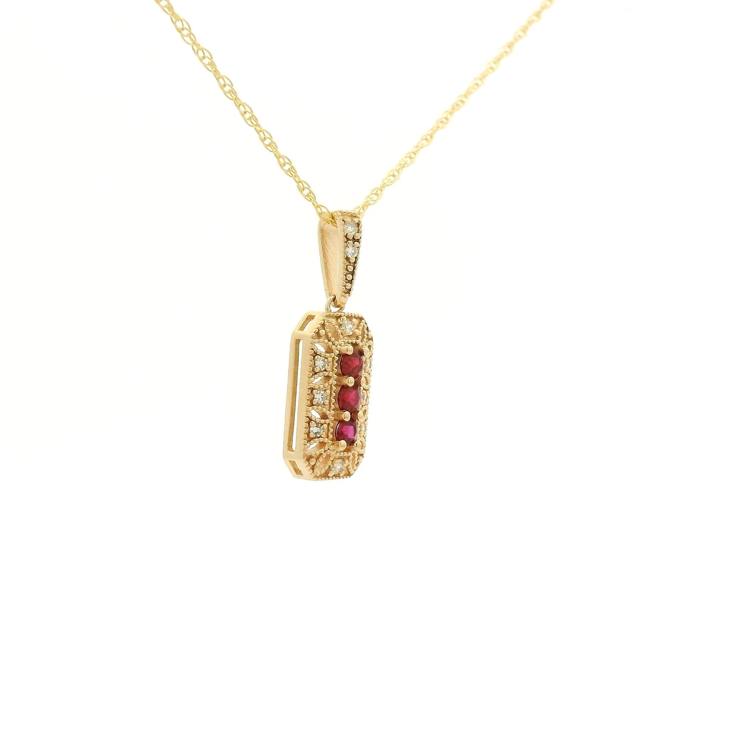 Yellow Gold Pendant with 3 prong set round cut natural Rubies in the center filigree design and diamonds at Forever Rox Fine Jewelry, Lake Tahoes Best Jewelry Store
