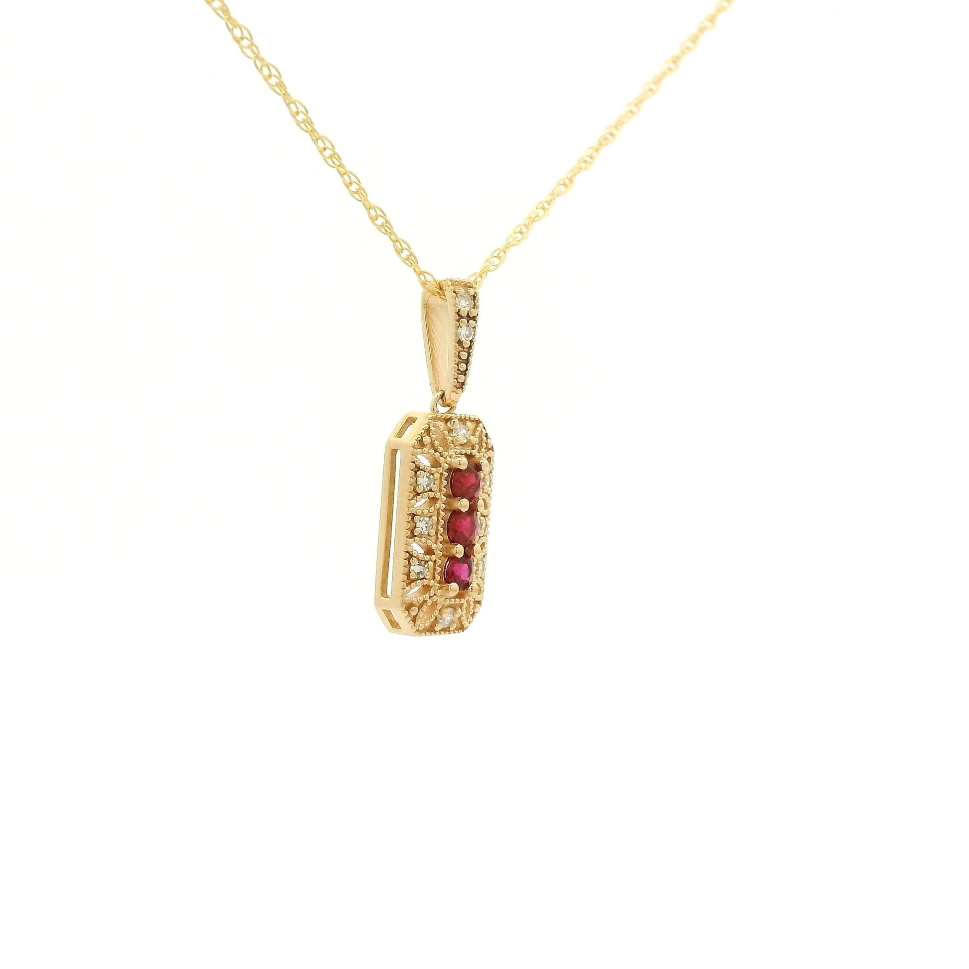Yellow Gold Pendant with 3 prong set round cut natural Rubies in the center filigree design and diamonds at Forever Rox Fine Jewelry, Lake Tahoes Best Jewelry Store
