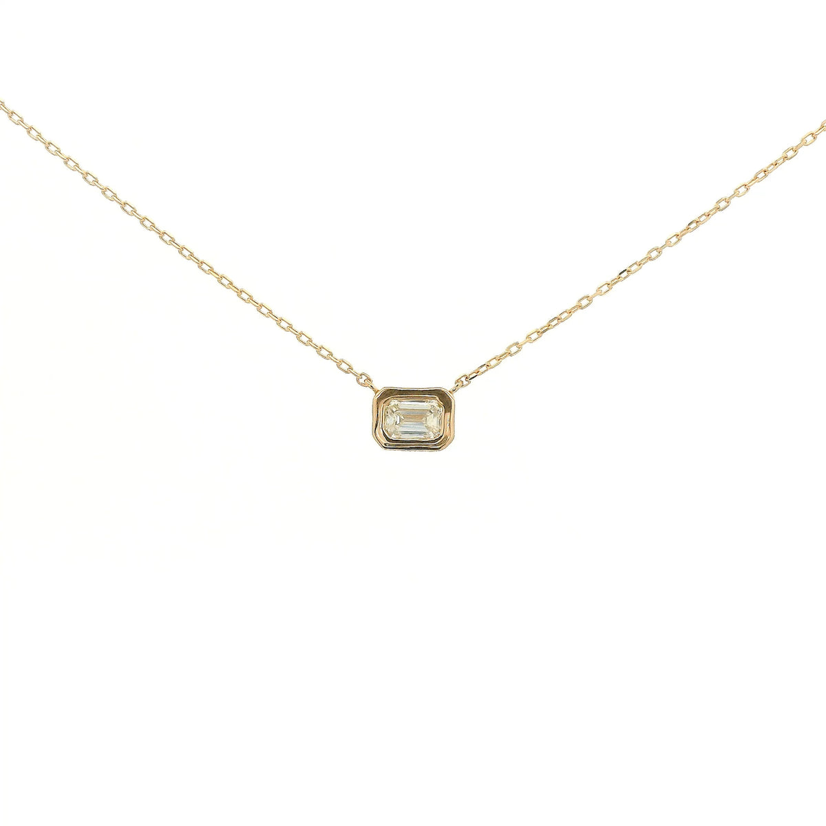 A Rose Gold Pendant with a bezel set emerald cut natural Diamond in the center at Forever Rox Fine Jewelry, Lake Tahoes Best Jewelry Store
