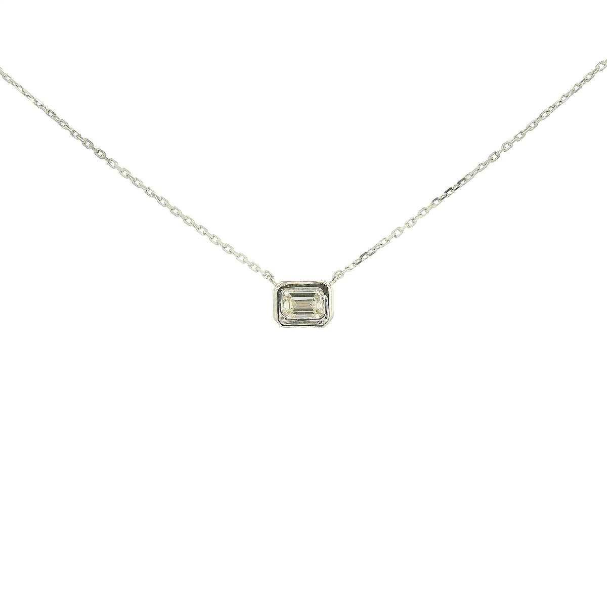 A White Gold Pendant with a bezel set emerald cut natural Diamond in the center at Forever Rox Fine Jewelry, Lake Tahoes Best Jewelry Store
