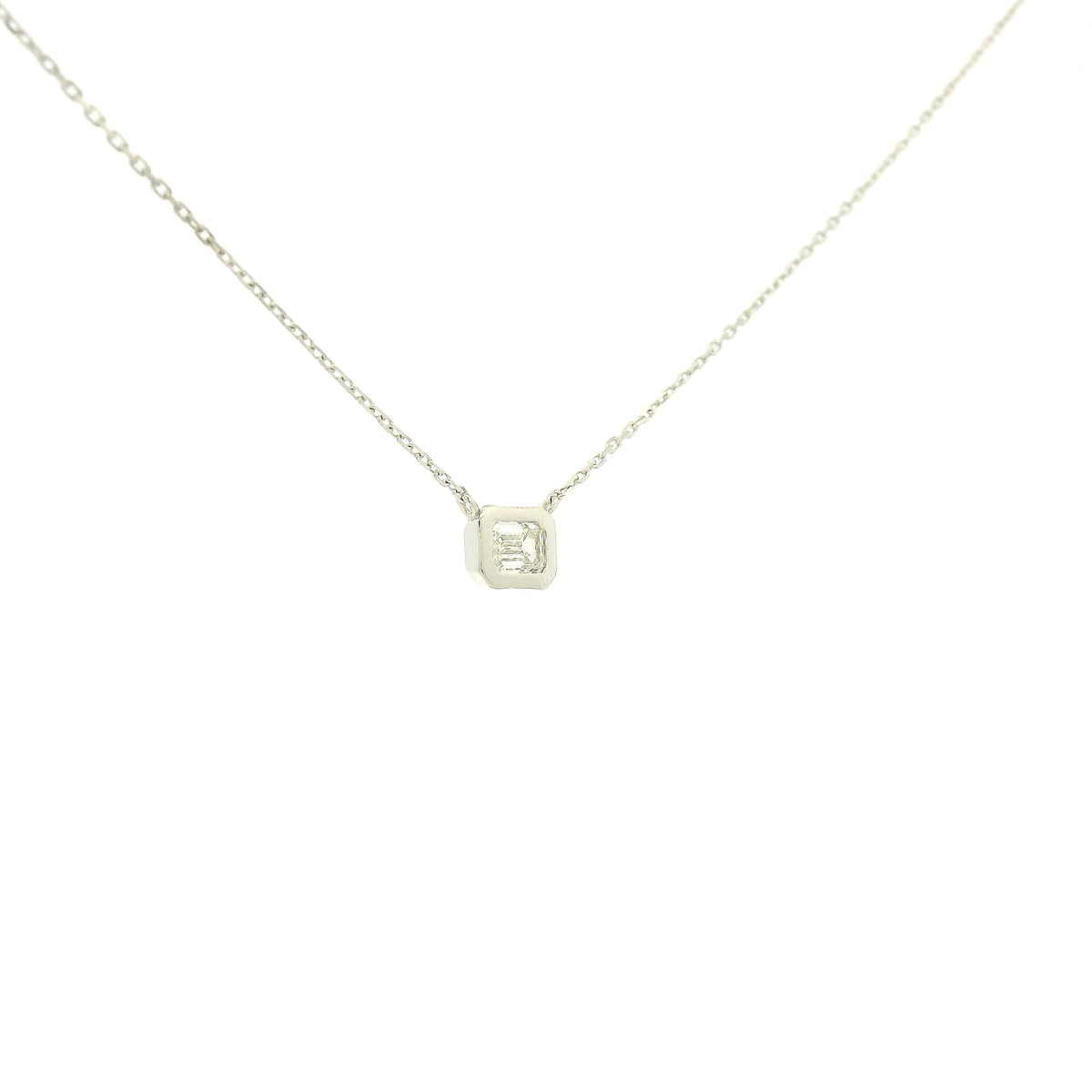 A White Gold Pendant with a bezel set emerald cut natural Diamond in the center at Forever Rox Fine Jewelry, Lake Tahoes Best Jewelry Store
