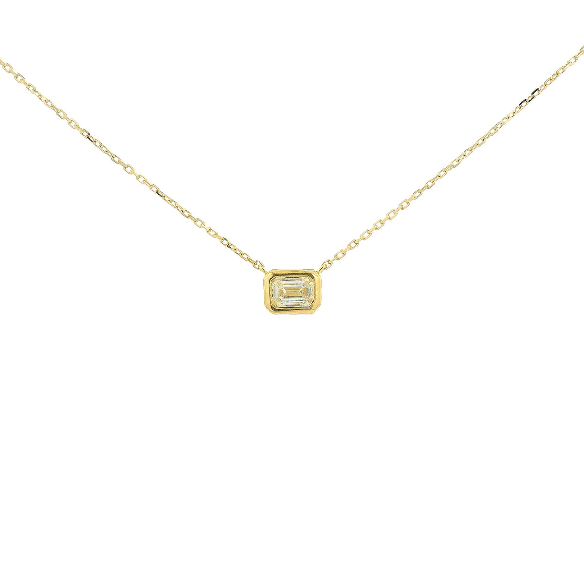 A Yellow Gold Pendant with a bezel set emerald cut natural Diamond in the center at Forever Rox Fine Jewelry, Lake Tahoes Best Jewelry Store
