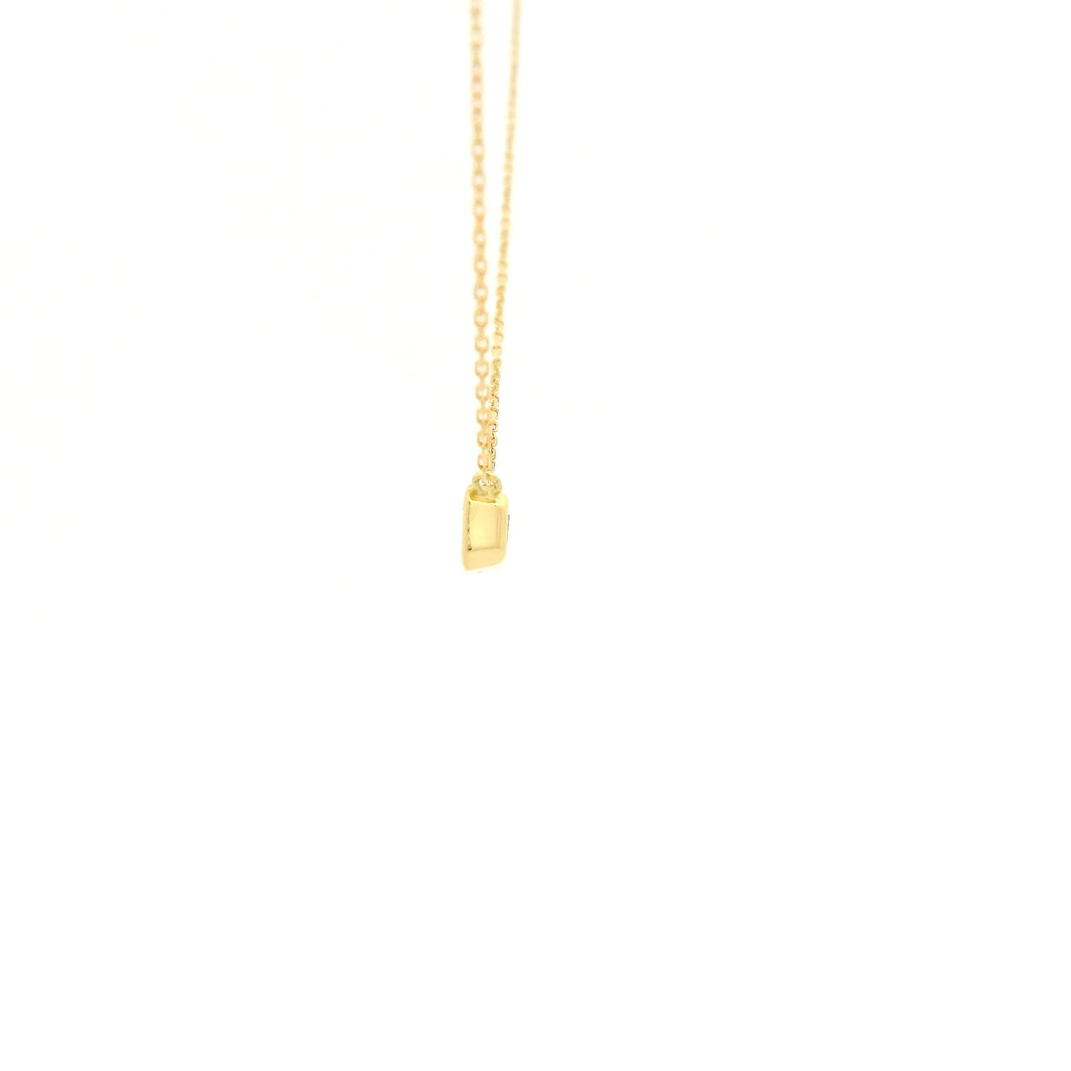 A Yellow Gold Pendant with a bezel set emerald cut natural Diamond in the center at Forever Rox Fine Jewelry, Lake Tahoes Best Jewelry Store
