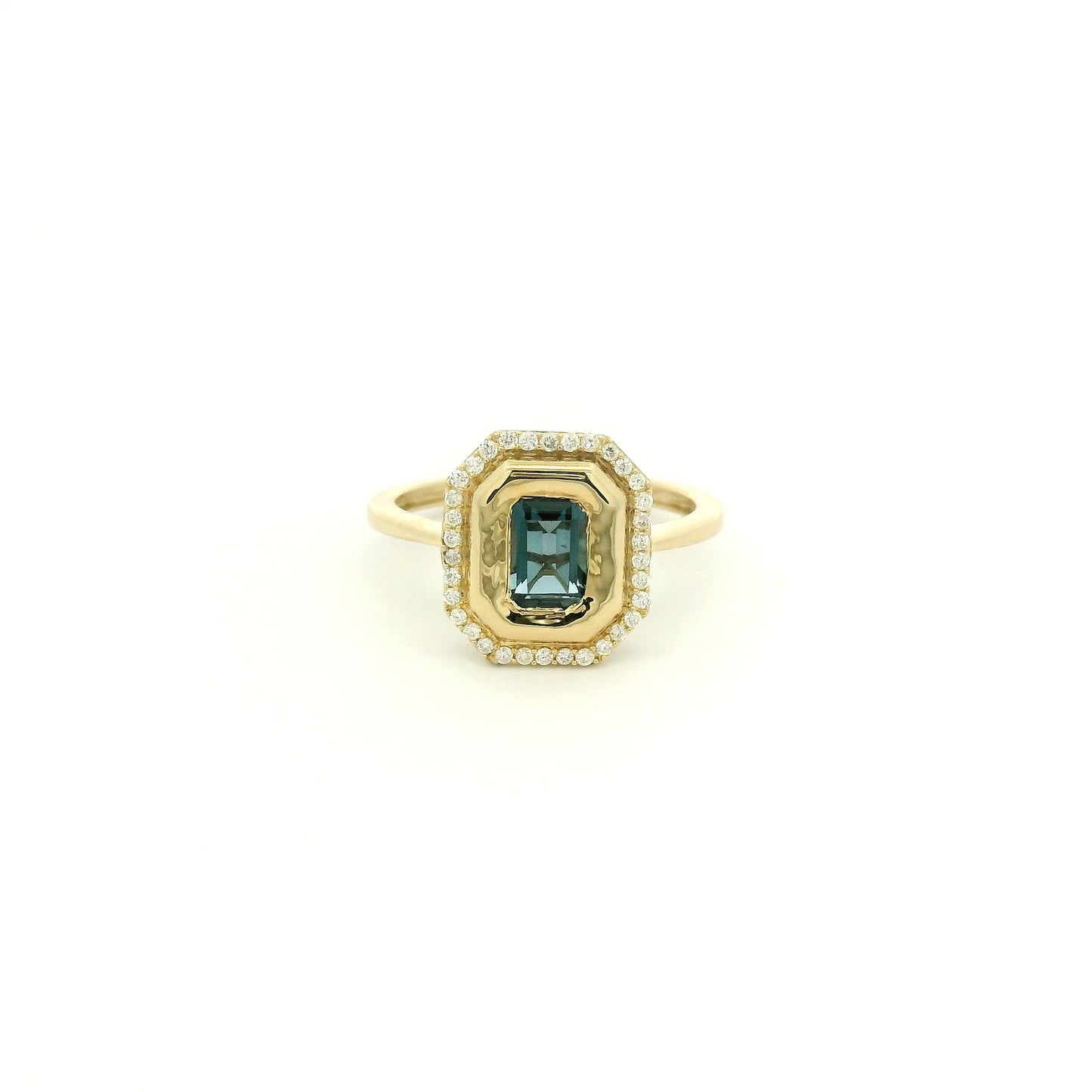 A Yellow Gold Ring with a bezel set emerald cut natural London Blue Topaz in the center with diamonds around the outside at Forever Rox Fine Jewelry, Lake Tahoes Best Jewelry Store
