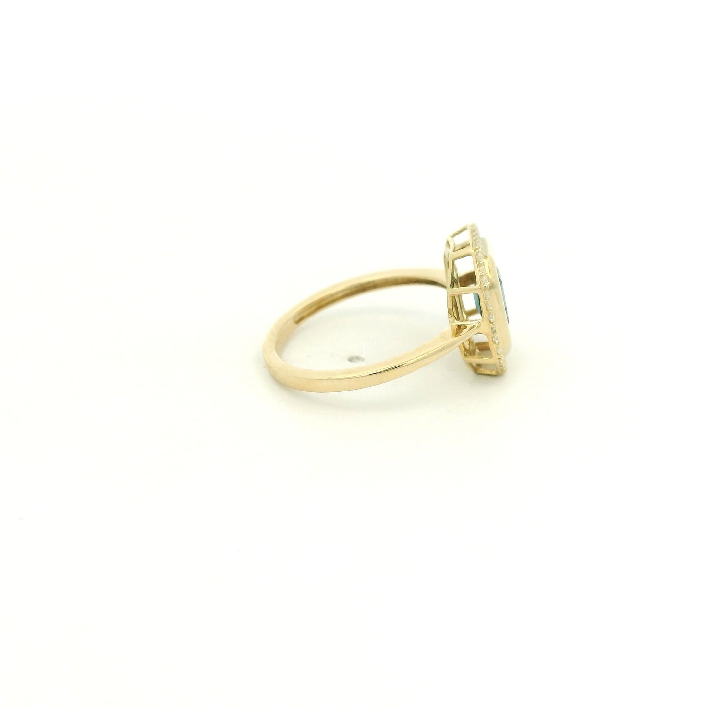 A Yellow Gold Ring with a bezel set emerald cut natural London Blue Topaz in the center with diamonds around the outside at Forever Rox Fine Jewelry, Lake Tahoes Best Jewelry Store
