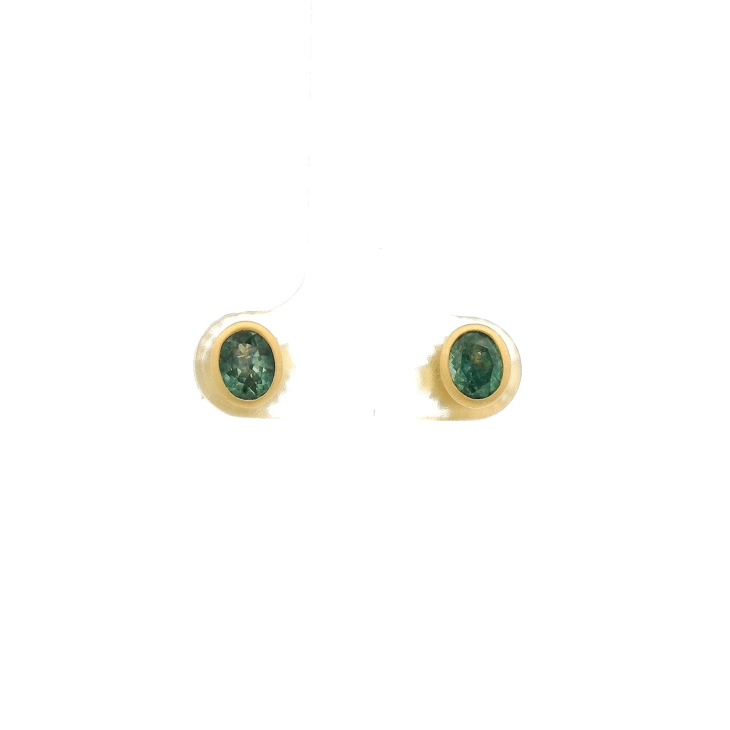 A Pair of Yellow Gold Earrings with bezel set oval cut natural Montana Sapphires at Forever Rox Fine Jewelry, Lake Tahoes Best Jewelry Store