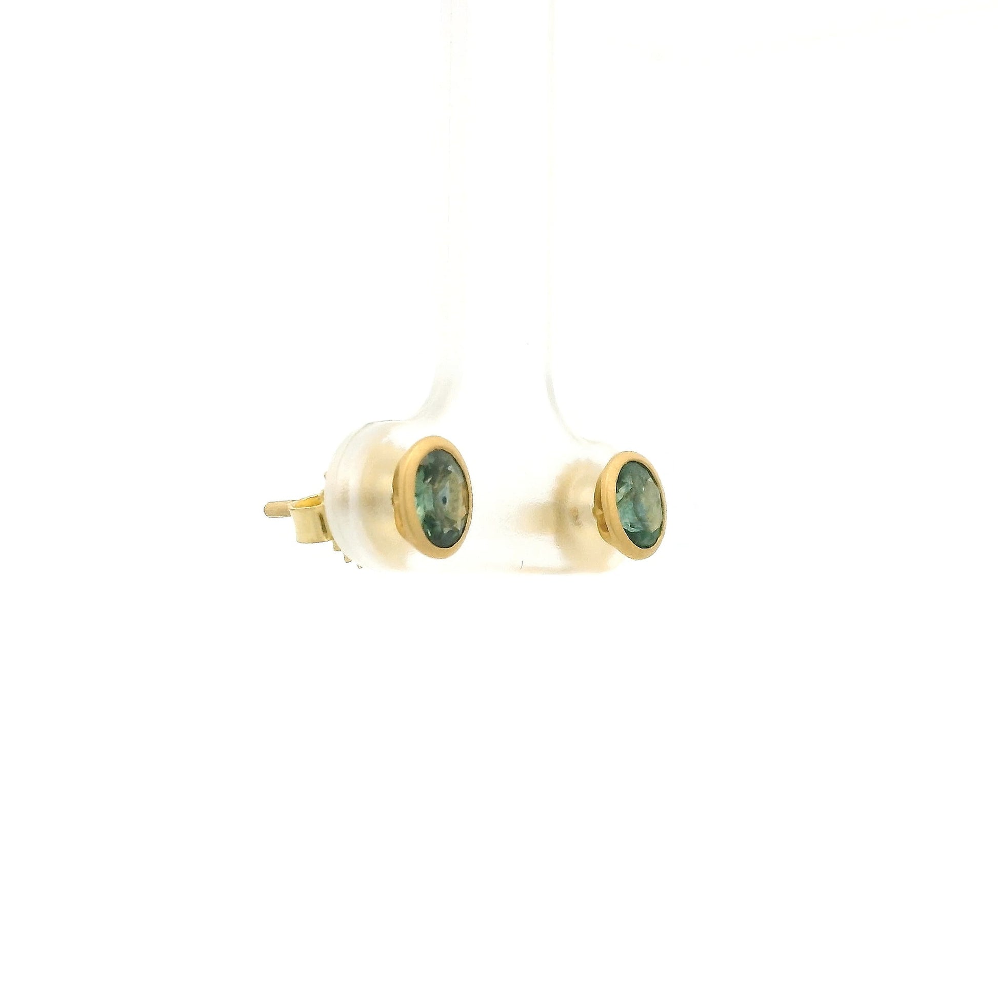 A Pair of Yellow Gold Earrings with bezel set oval cut natural Montana Sapphires at Forever Rox Fine Jewelry, Lake Tahoes Best Jewelry Store