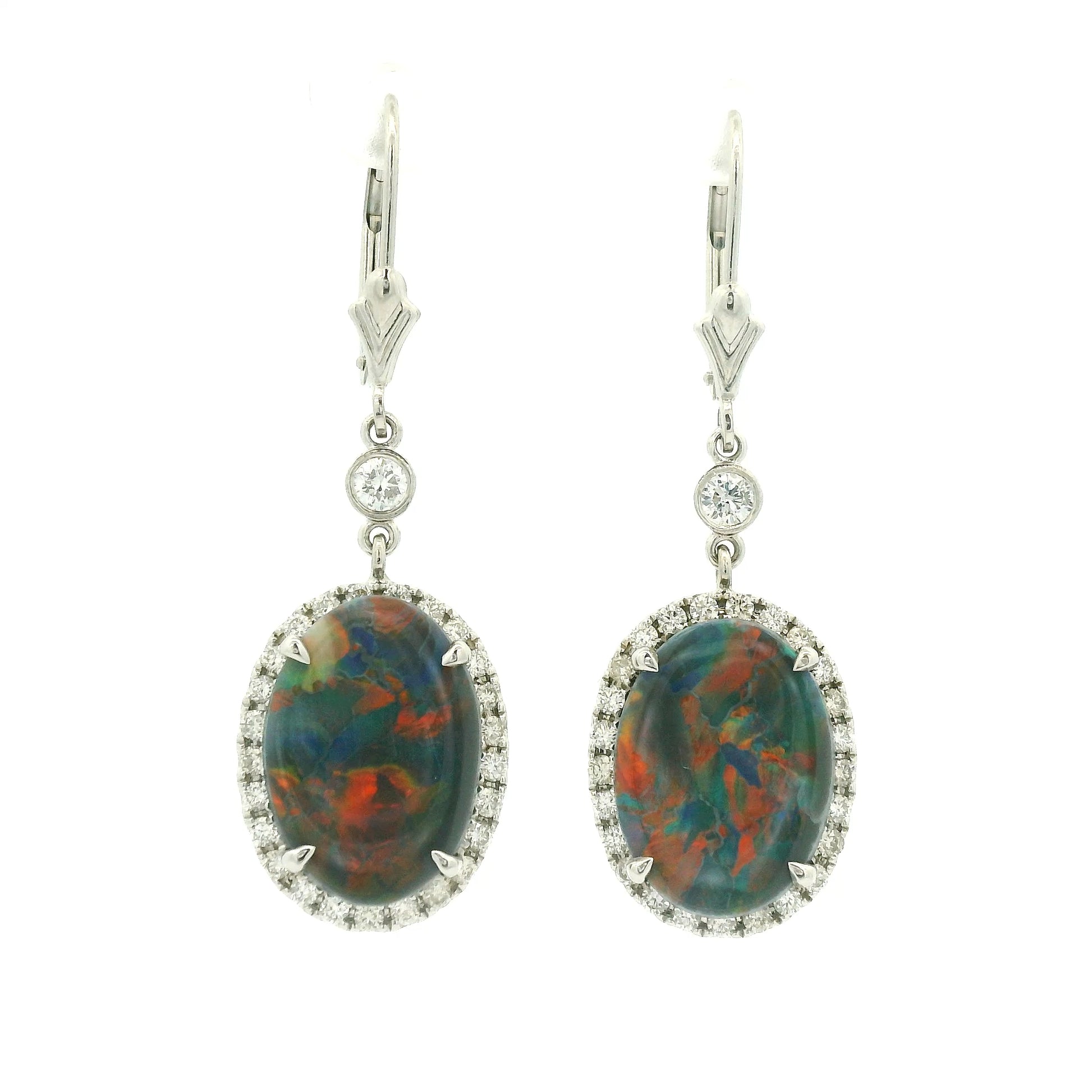 A Pair of White Gold Earrings with prong set oval cut natural Black Lightning Ridge Opals in the center with a diamond halo at Forever Rox Fine Jewelry, Lake Tahoes Best Jewelry Store