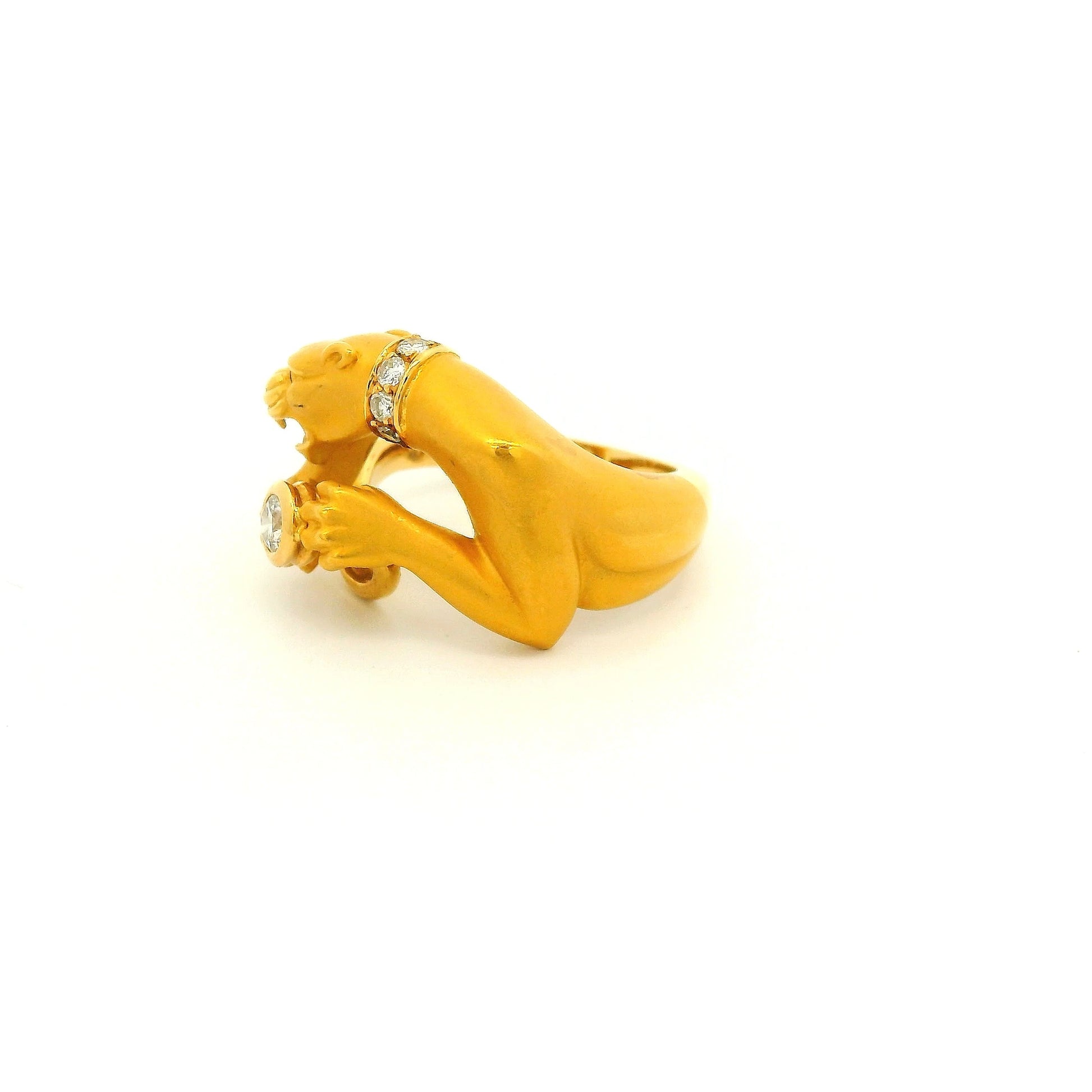 A Yellow Gold Ring Signed Carrera Y Carrera with a bezel set round cut natural Diamond in the center of the paws with a diamond collar and Ruby eye at Forever Rox Fine Jewelry, Lake Tahoes Best Jewelry Store
