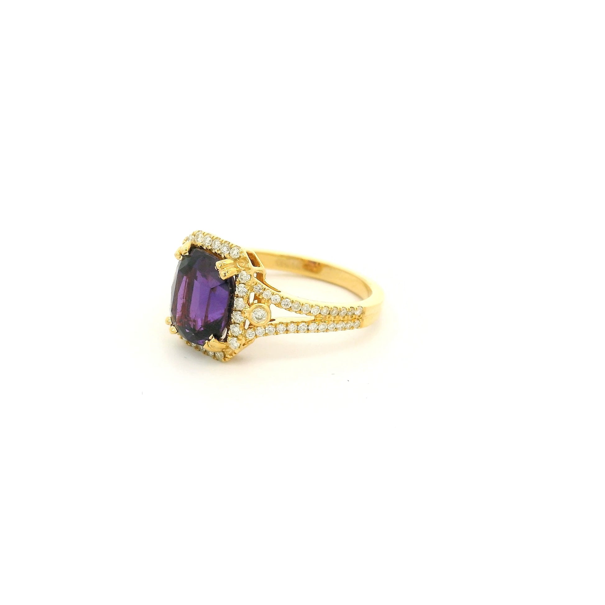 A Yellow Gold Ring with a prong set cushion cut NO Heat natural Purple Sapphire in the center with diamond accents at Forever Rox Fine Jewelry, Lake Tahoes Best Jewelry Store
