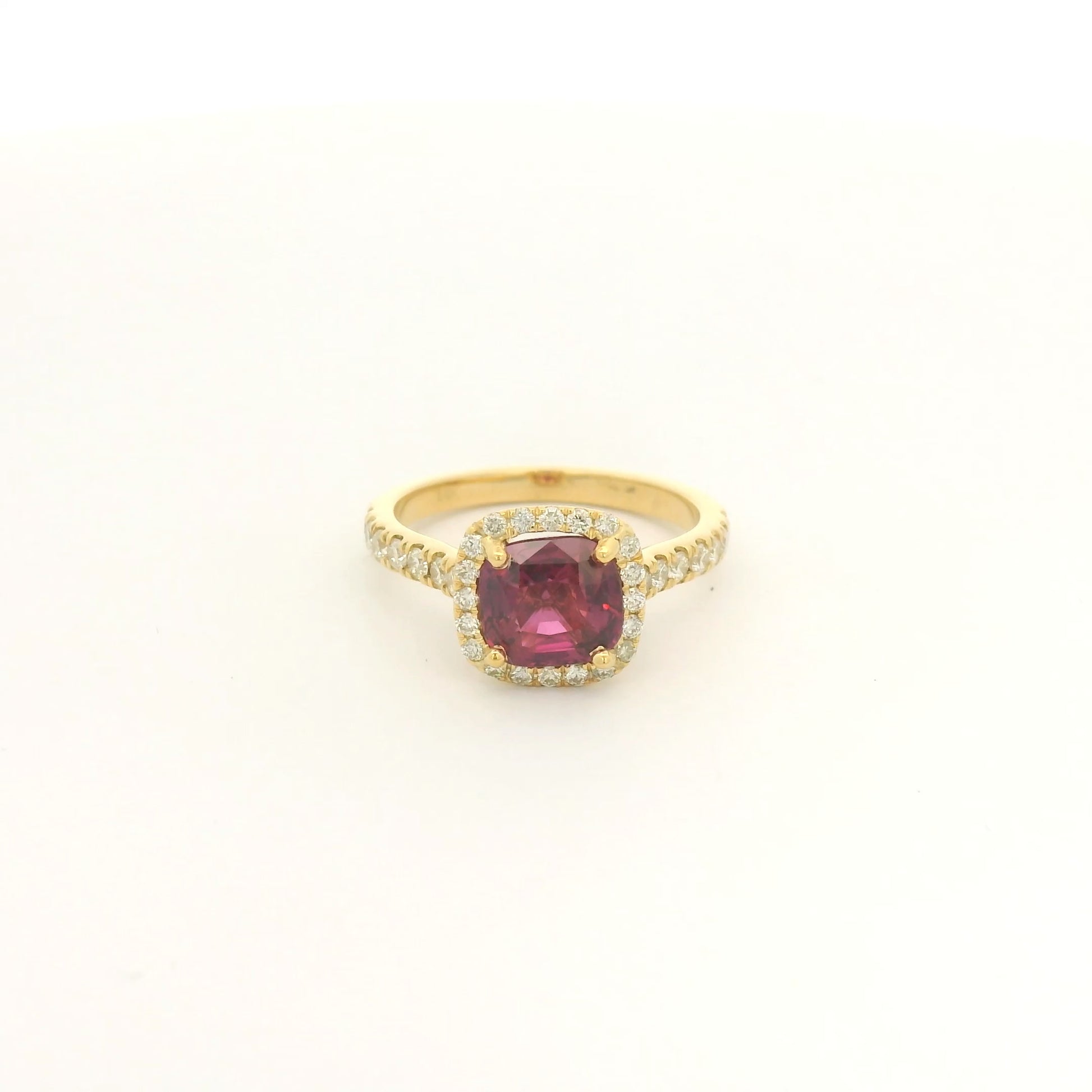 A Yellow Gold Ring with a prong set cushion cut certified TGC no heat natural Ruby in the center with a diamond bezel and down shank at Forever Rox Fine Jewelry, Lake Tahoes Best Jewelry Store