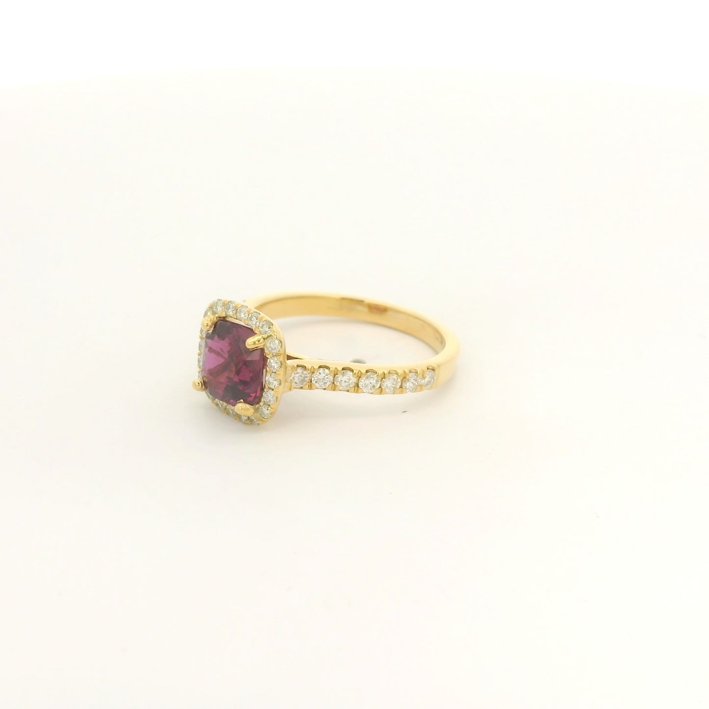 A Yellow Gold Ring with a prong set cushion cut certified TGC no heat natural Ruby in the center with a diamond bezel and down shank at Forever Rox Fine Jewelry, Lake Tahoes Best Jewelry Store