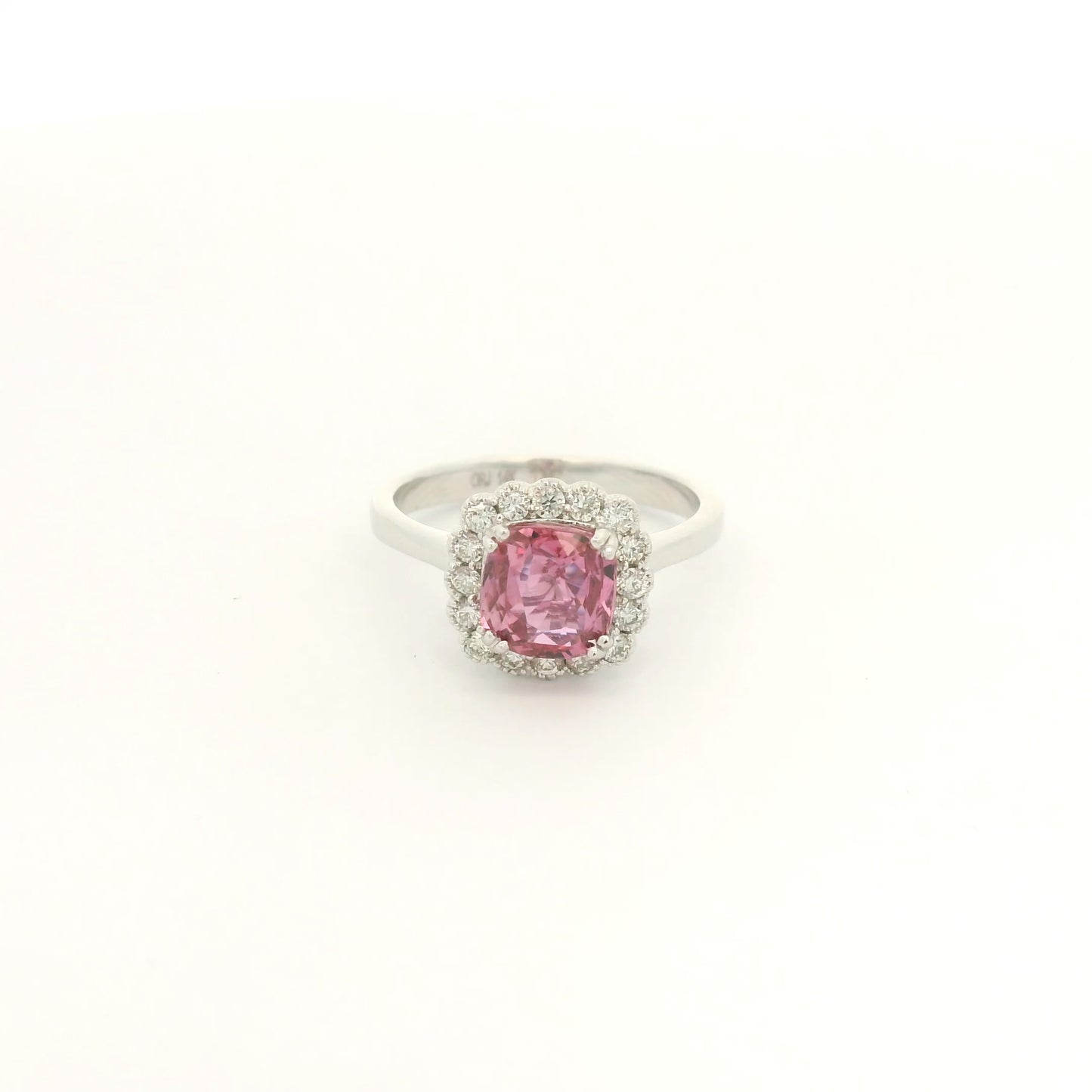 A White Gold Ring with a prong set cushion cut natural Certified Padparadscha Sapphire in the center with a diamond halo at Forever Rox Fine Jewelry, Lake Tahoes Best Jewelry Store
