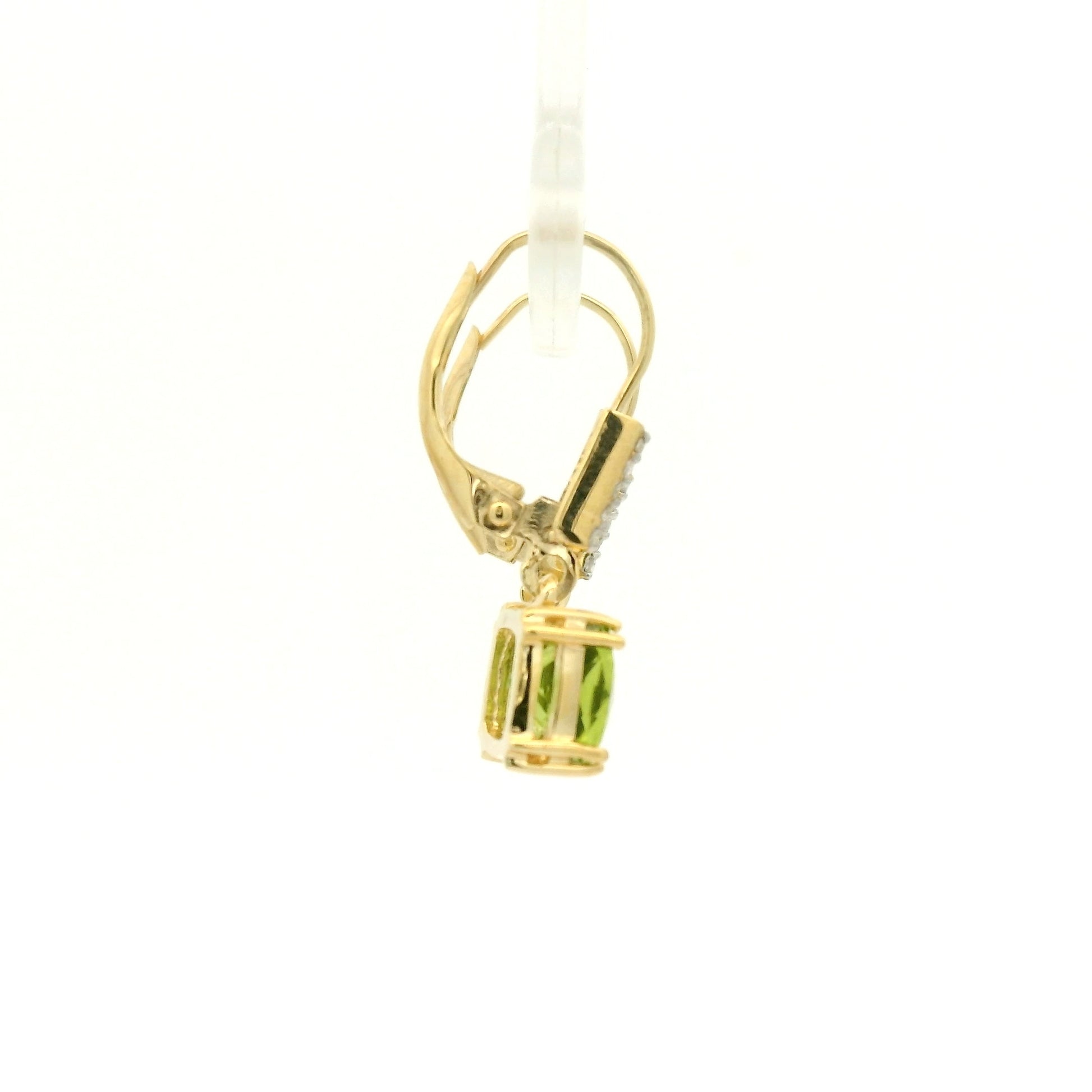 A Pair of Yellow Gold Dangle Earrings with prong set fancy cushion cut natural Peridots at the bottom with 4 diamonds dangle at Forever Rox Fine Jewelry, Lake Tahoes Best Jewelry Store
