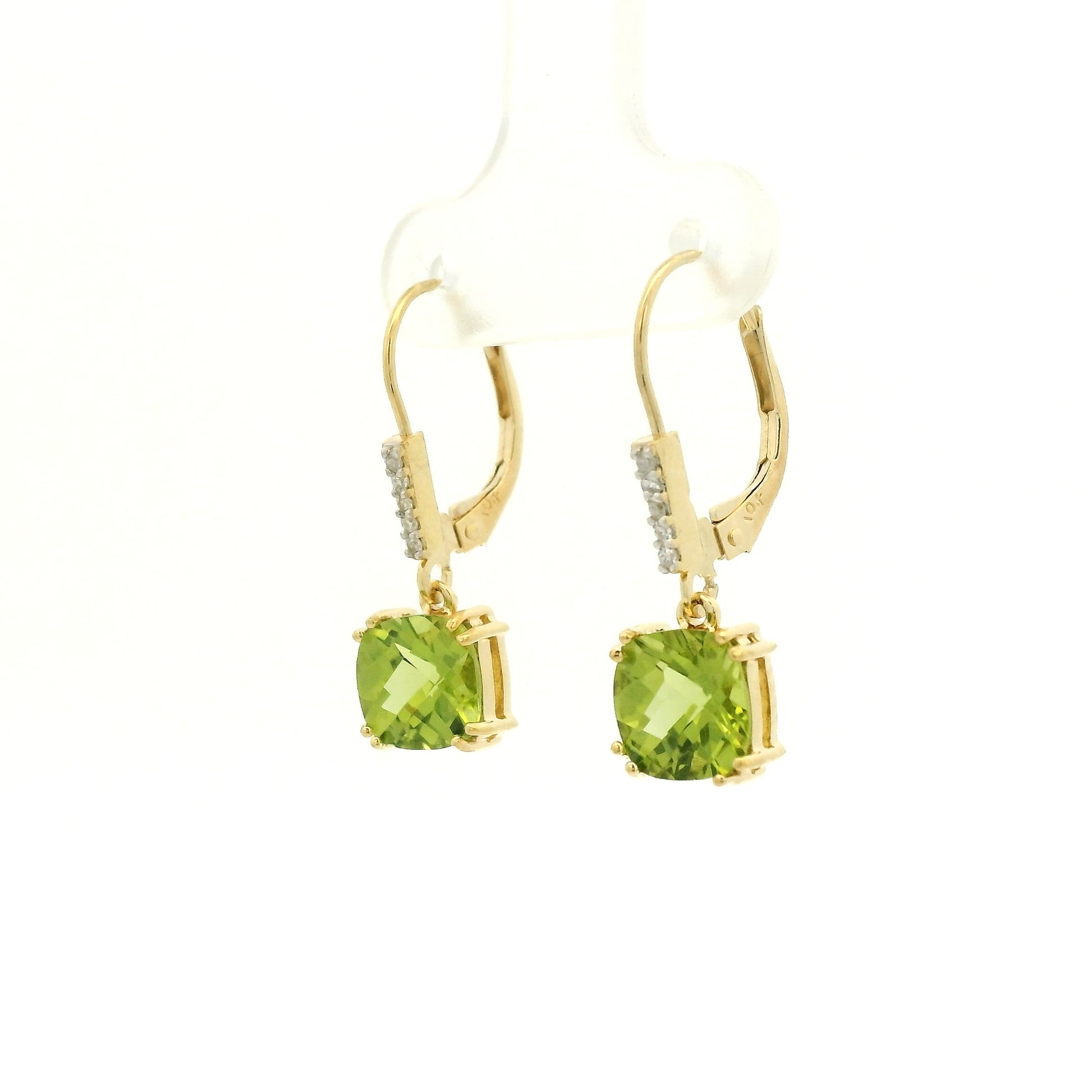 A Pair of Yellow Gold Dangle Earrings with prong set fancy cushion cut natural Peridots at the bottom with 4 diamonds dangle at Forever Rox Fine Jewelry, Lake Tahoes Best Jewelry Store
