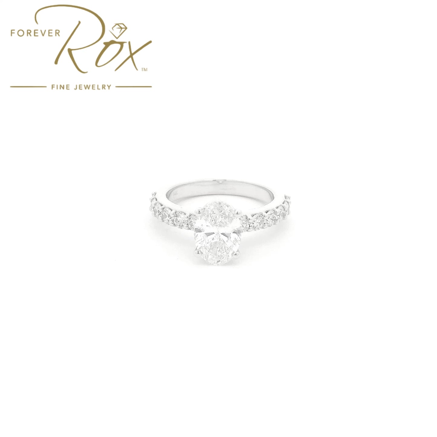 Custom 14k white gold oval diamond engagement ring with GIA certified 1.21ct D color SI1 natural diamond and 0.60ct diamond band by Forever Rox Fine Jewelry, Lake Tahoes Best Jewelry Store