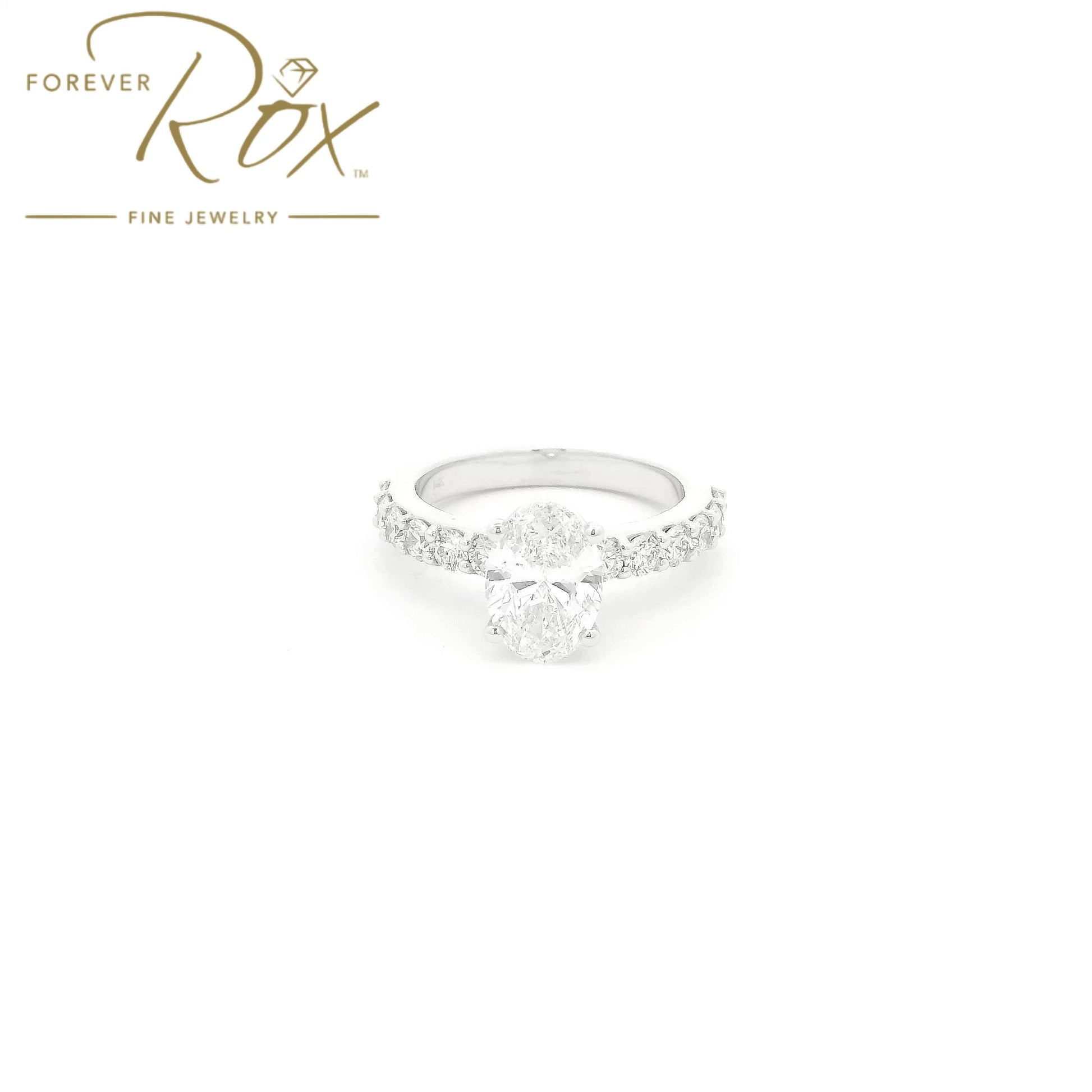 Custom 14k white gold oval diamond engagement ring with GIA certified 1.21ct D color SI1 natural diamond and 0.60ct diamond band by Forever Rox Fine Jewelry, Lake Tahoes Best Jewelry Store
