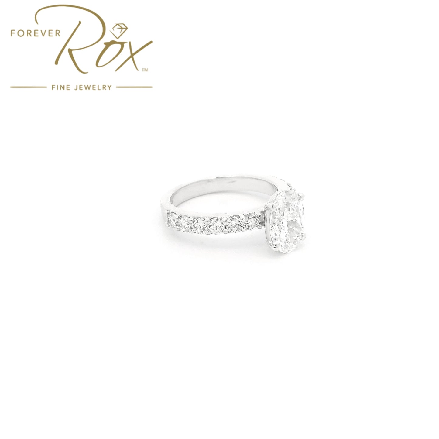 Custom 14k white gold oval diamond engagement ring with GIA certified 1.21ct D color SI1 natural diamond and 0.60ct diamond band by Forever Rox Fine Jewelry, Lake Tahoes Best Jewelry Store