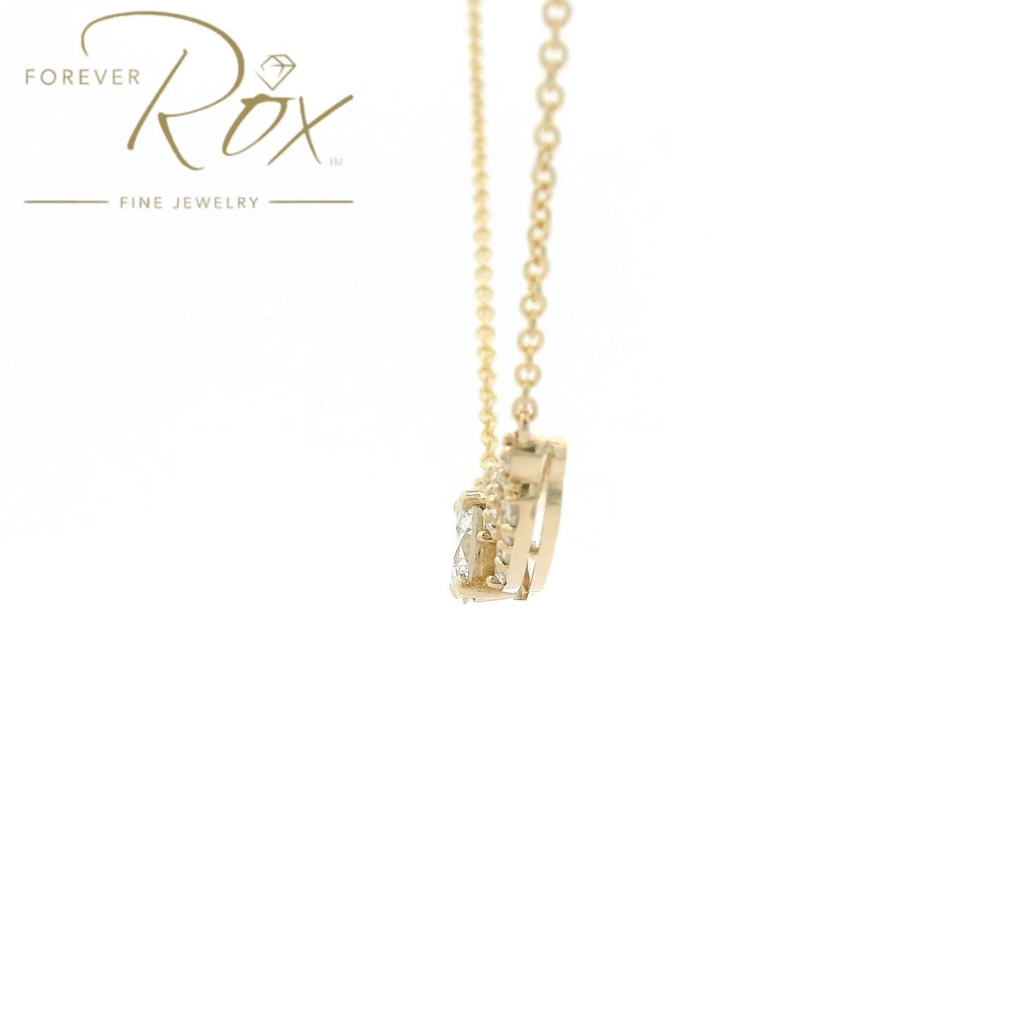 This custom pendant showcases a breathtaking 1.85 carat round brilliant-cut diamond at its center, gracefully set within a flowing curved design crafted in 14k yellow gold. Accented by a cascade of smaller diamonds along each side, the pendant creates a beautiful balance of brilliance and elegance. Designed to highlight the exceptional center stone, this timeless custom piece offers a refined look with sparkle from every angle.