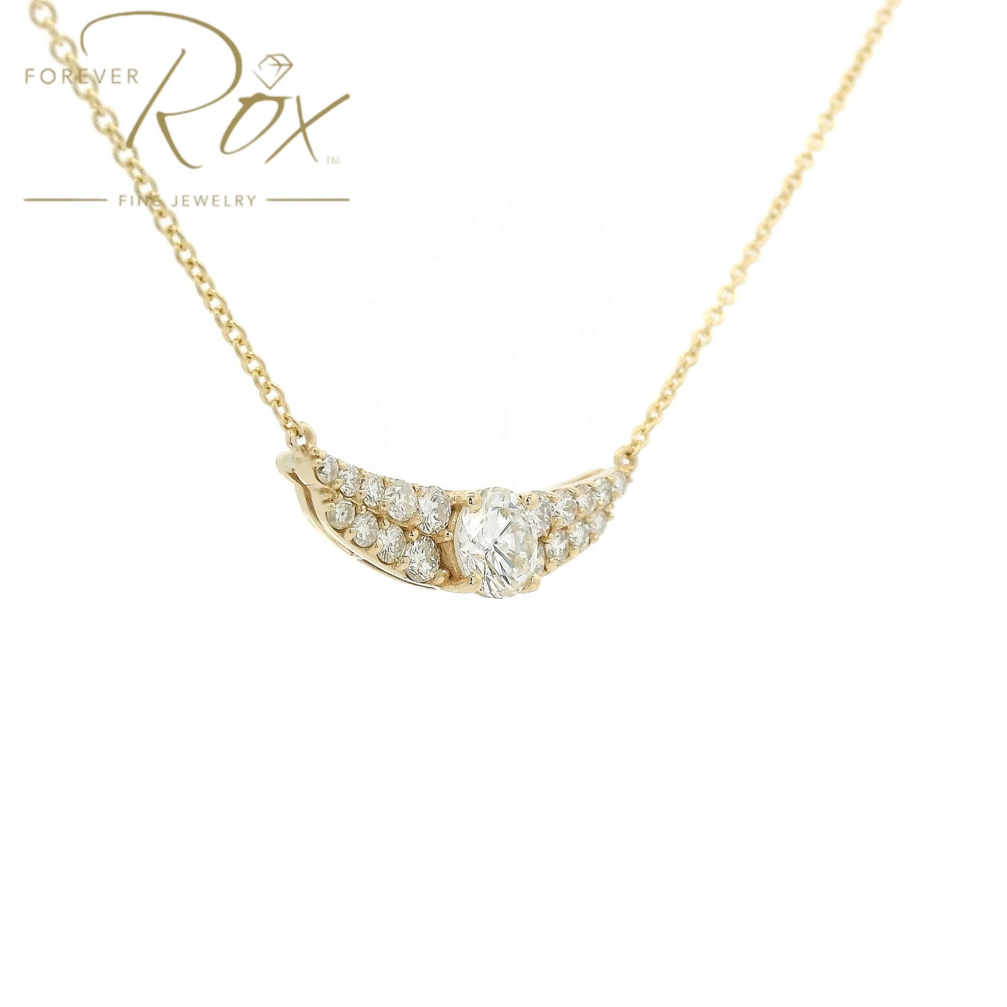 This custom pendant showcases a breathtaking 1.85 carat round brilliant-cut diamond at its center, gracefully set within a flowing curved design crafted in 14k yellow gold. Accented by a cascade of smaller diamonds along each side, the pendant creates a beautiful balance of brilliance and elegance. Designed to highlight the exceptional center stone, this timeless custom piece offers a refined look with sparkle from every angle.