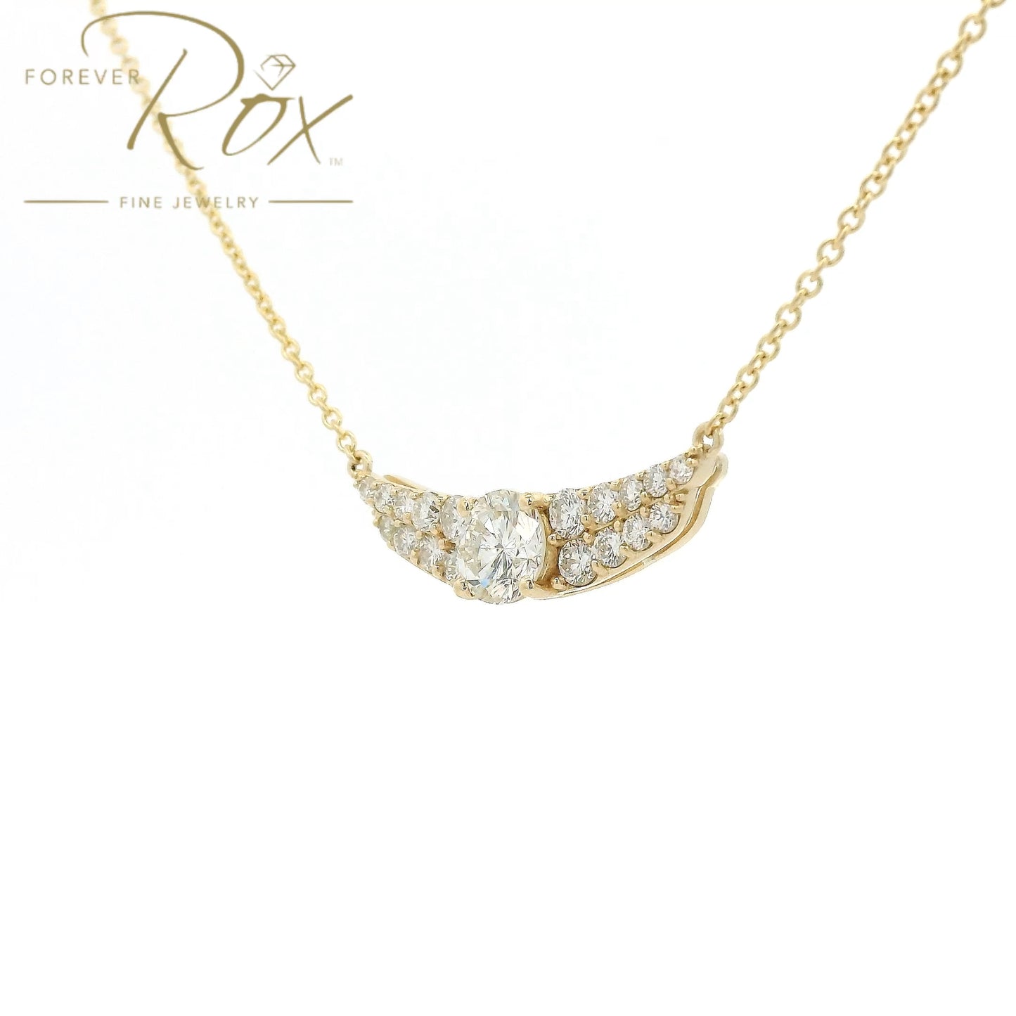 This custom pendant showcases a breathtaking 1.85 carat round brilliant-cut diamond at its center, gracefully set within a flowing curved design crafted in 14k yellow gold. Accented by a cascade of smaller diamonds along each side, the pendant creates a beautiful balance of brilliance and elegance. Designed to highlight the exceptional center stone, this timeless custom piece offers a refined look with sparkle from every angle.