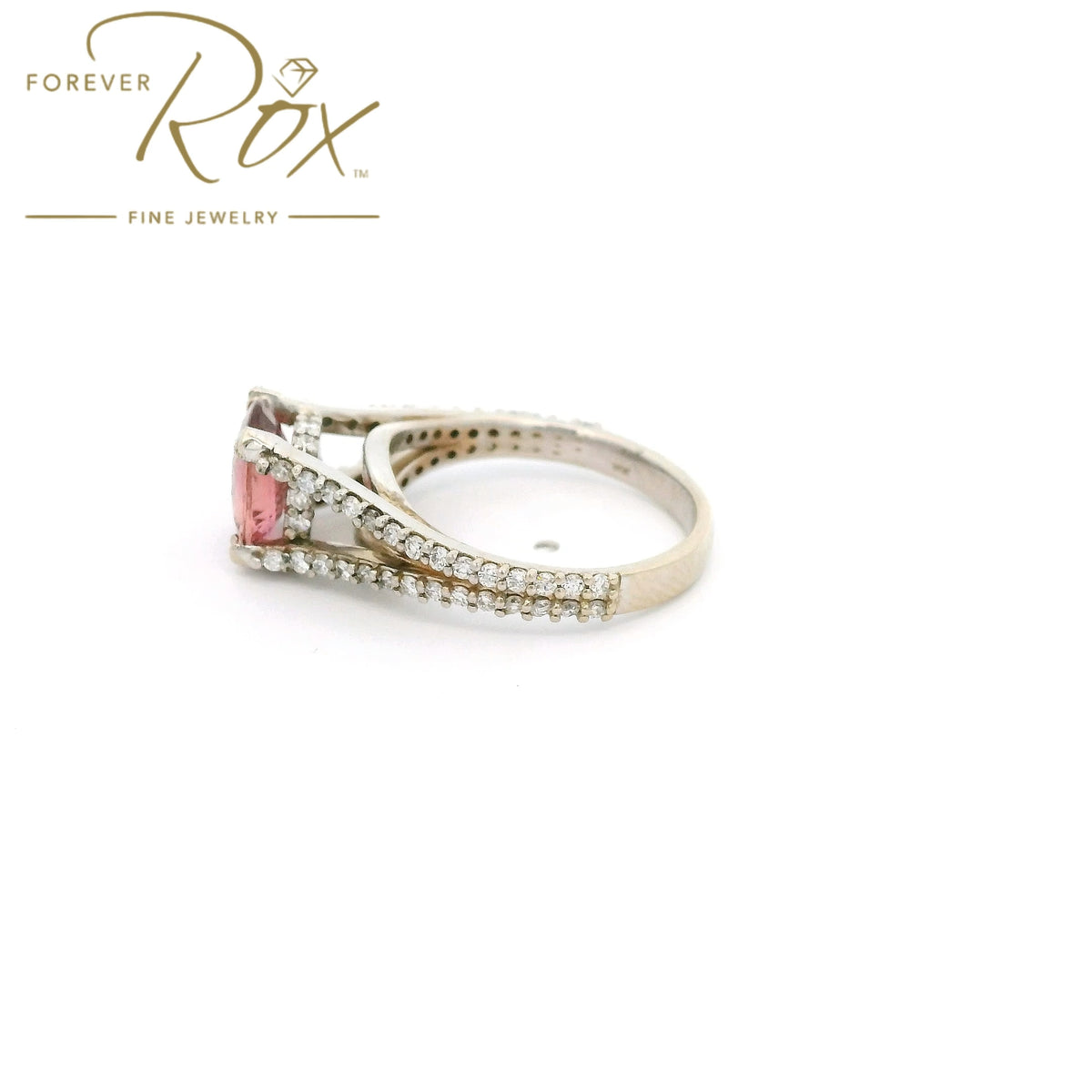 A White Gold Ring with a prong set oval cut natural AGL Certified Padparadscha Sapphire in the center wdiamond accents on the ring at Forever Rox Fine Jewelry, Lake Tahoes Best Jewelry Store
