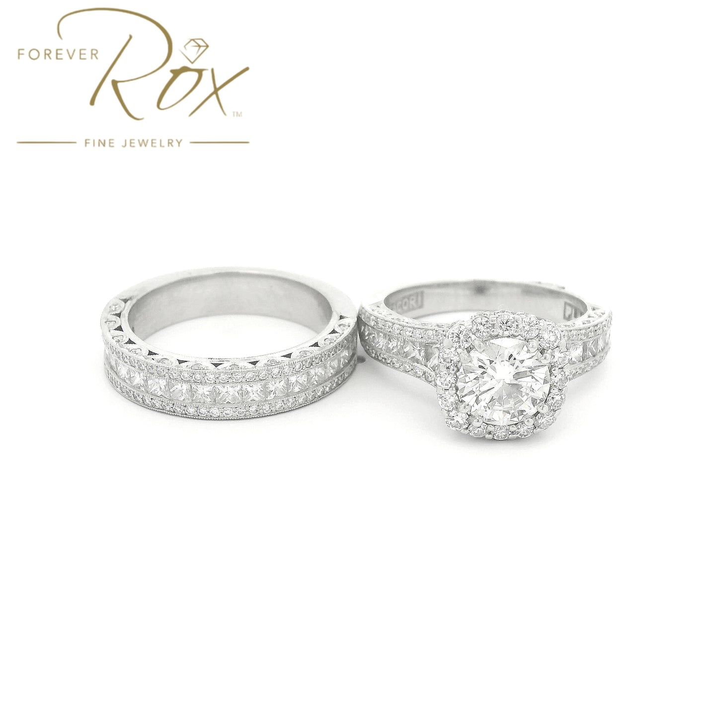 This custom 14k white gold diamond band was designed to perfectly complement a client’s original ring that we previously created for her. The center features a row of channel-set princess-cut diamonds, framed above and below by channel-set round brilliant diamonds for added sparkle. Intricate filigree detailing along the edges was carefully incorporated to match the design of her original ring, creating a cohesive, one-of-a-kind set made especially for her.