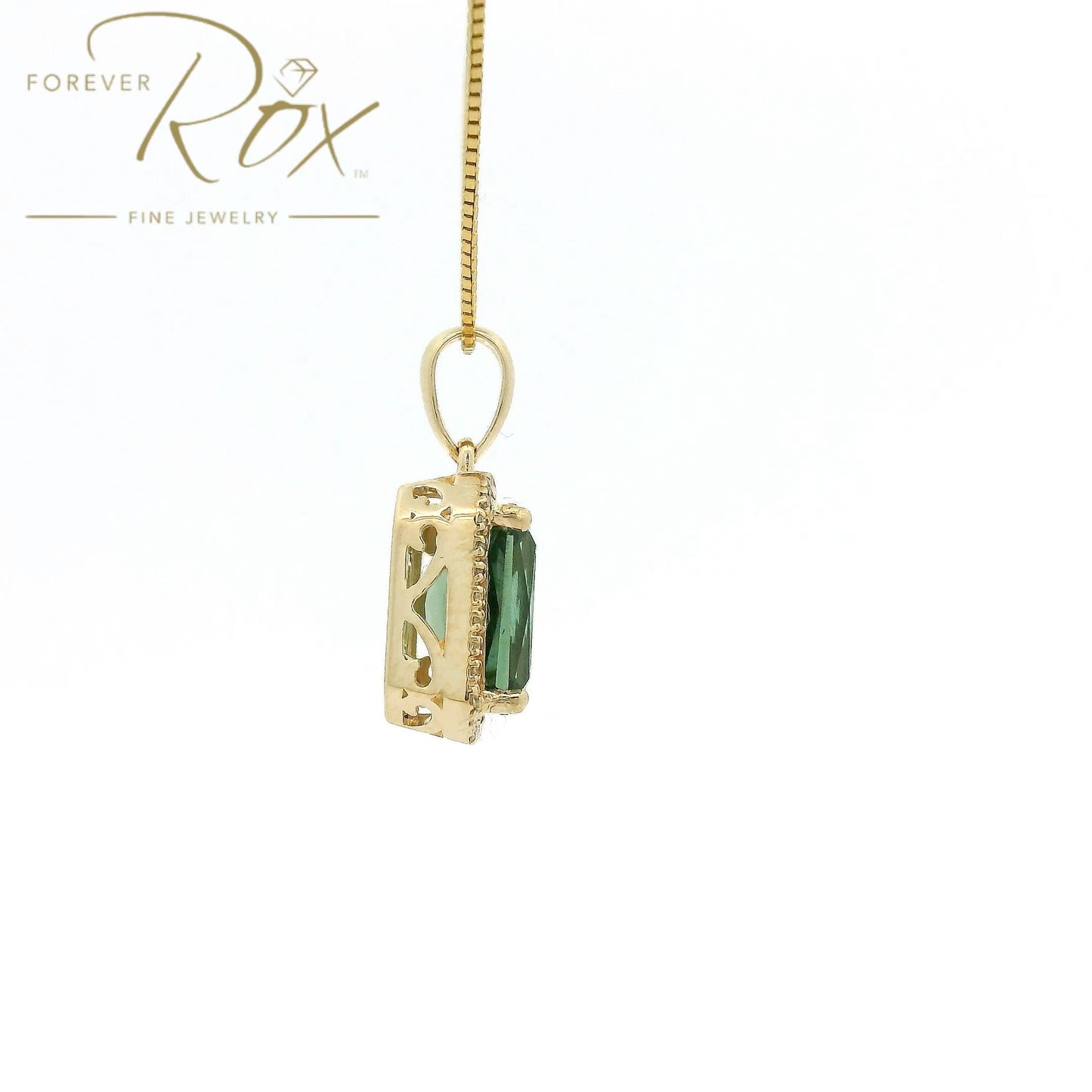 A Yellow Gold Pendant with a prong set emerald cut natural Mint Tourmaline in the center with a halow of diamonds at Forever Rox Fine Jewelry, Lake Tahoes Best Jewelry Store