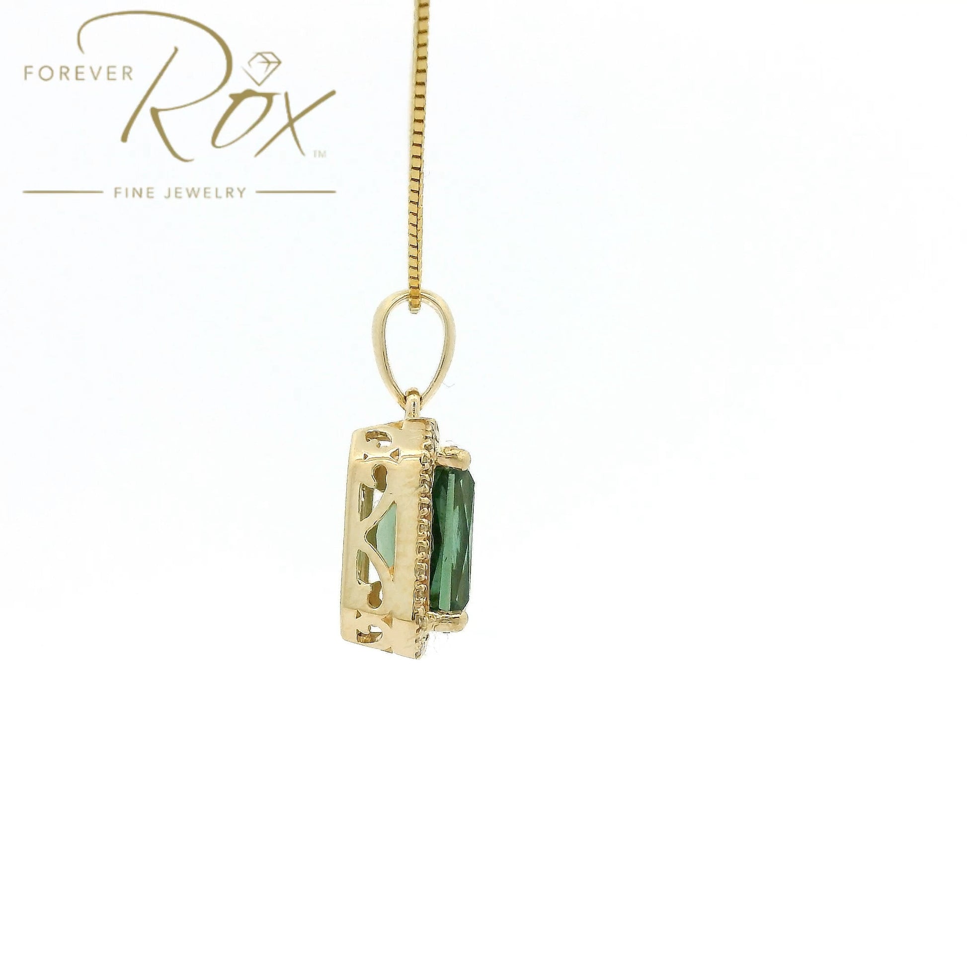 A Yellow Gold Pendant with a prong set emerald cut natural Mint Tourmaline in the center with a halow of diamonds at Forever Rox Fine Jewelry, Lake Tahoes Best Jewelry Store