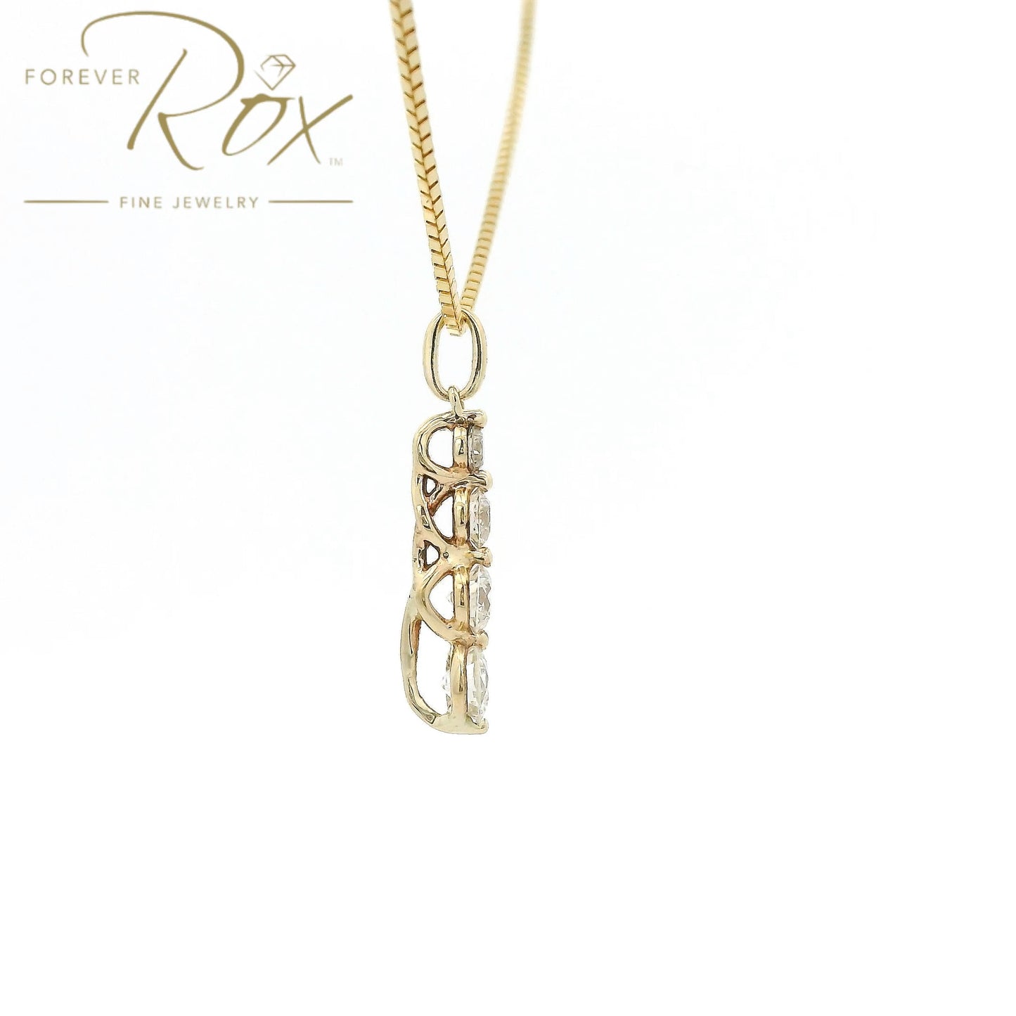 This custom pendant features four round brilliant-cut diamonds arranged in a graceful graduating design, creating a beautiful flow of sparkle from top to bottom. Expertly set in 14k yellow gold, the pendant combines timeless elegance with everyday wearability, allowing each diamond to shine while showcasing the warmth of the gold.