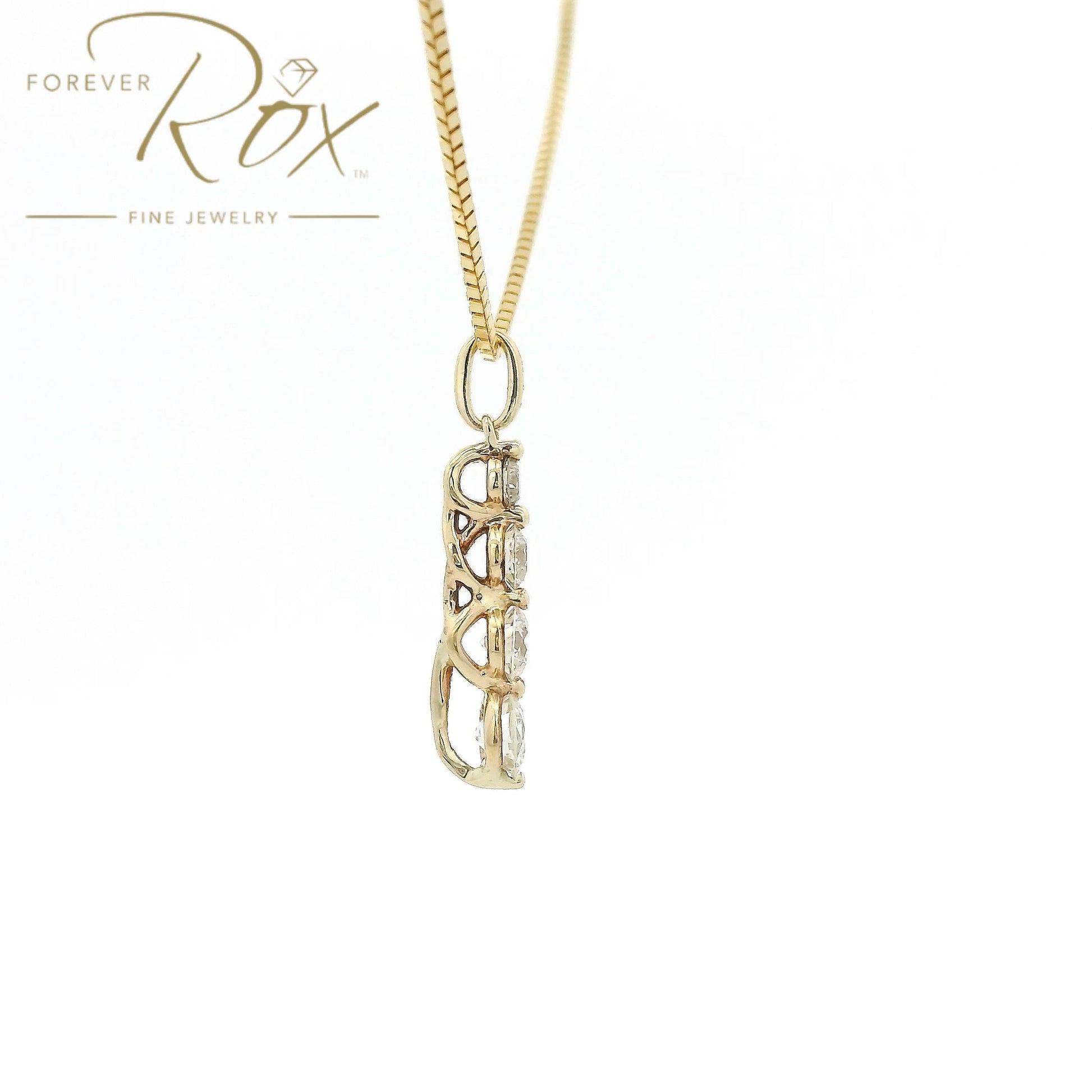 This custom pendant features four round brilliant-cut diamonds arranged in a graceful graduating design, creating a beautiful flow of sparkle from top to bottom. Expertly set in 14k yellow gold, the pendant combines timeless elegance with everyday wearability, allowing each diamond to shine while showcasing the warmth of the gold.