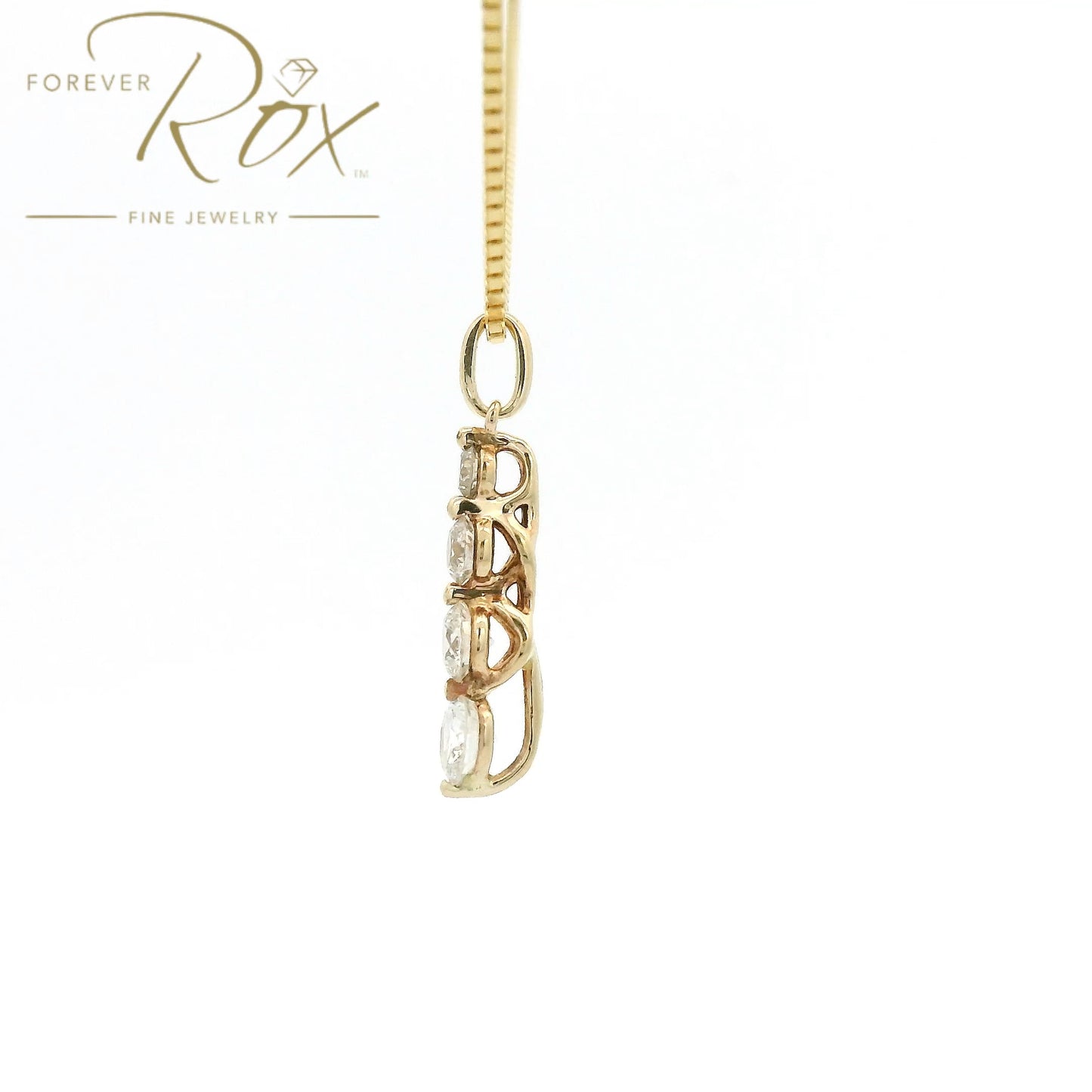 This custom pendant features four round brilliant-cut diamonds arranged in a graceful graduating design, creating a beautiful flow of sparkle from top to bottom. Expertly set in 14k yellow gold, the pendant combines timeless elegance with everyday wearability, allowing each diamond to shine while showcasing the warmth of the gold.