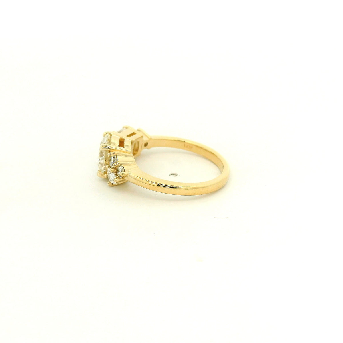 This custom 14k yellow gold engagement ring features a 1.53 ct H-VS2 round brilliant diamond accented by an asymmetrical arrangement of mixed-cut natural diamonds, including a .70 ct F-VVS2 emerald cut, .15 ct G-VS2 pear cut, .17 ct square emerald cut, and two smaller round diamonds. 