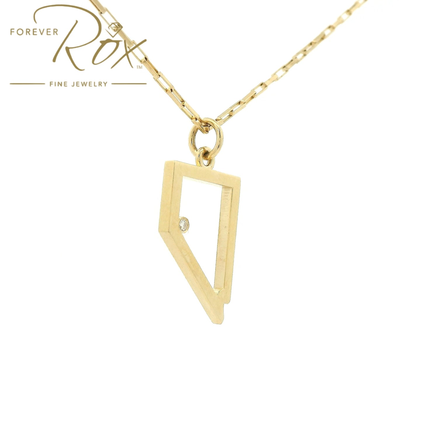 A Yellow Gold Nevada Outline Pendant with a bezel set round cut natural Diamond where Lake Tahoe is at Forever Rox Fine Jewelry, Lake Tahoes Best Jewelry Store