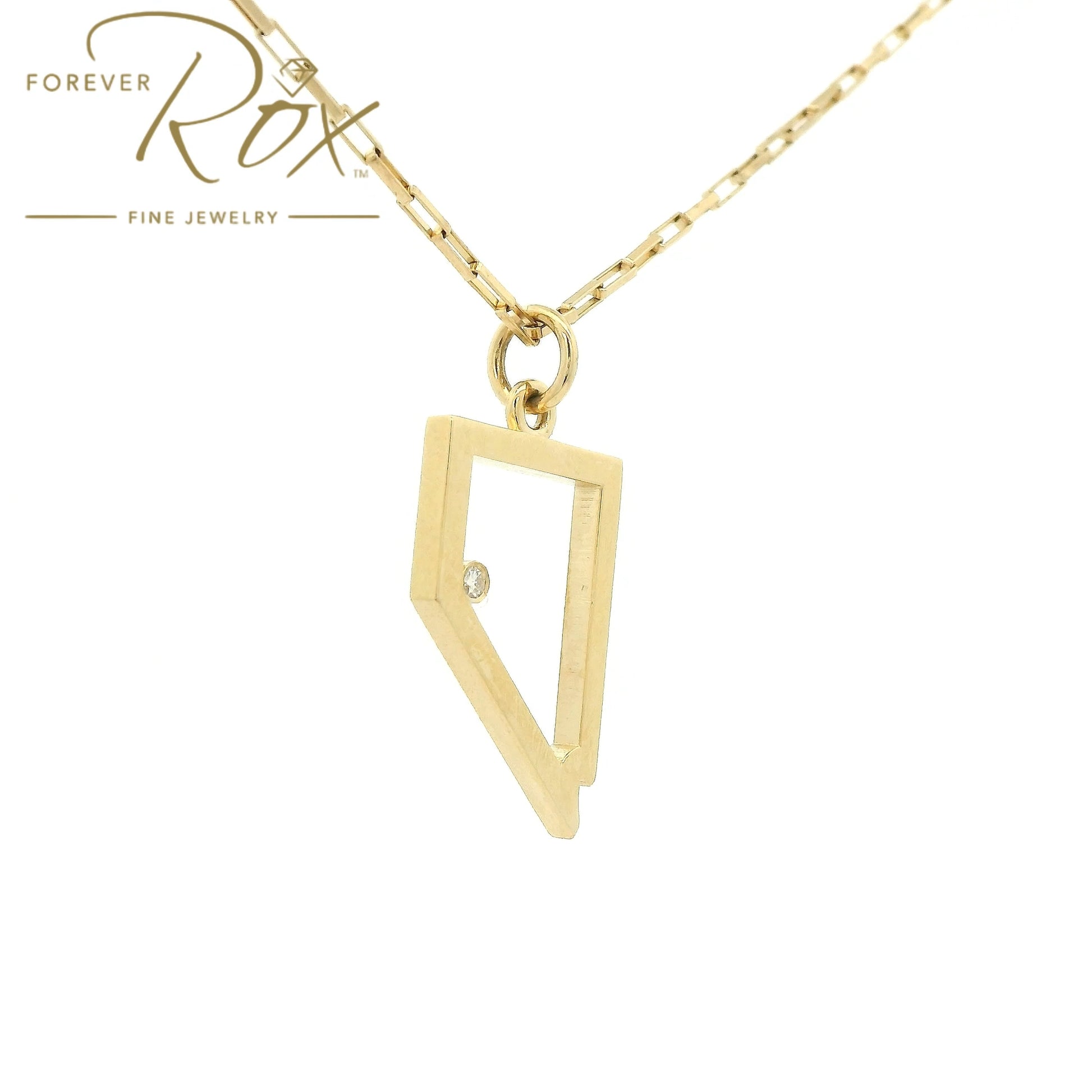 A Yellow Gold Nevada Outline Pendant with a bezel set round cut natural Diamond where Lake Tahoe is at Forever Rox Fine Jewelry, Lake Tahoes Best Jewelry Store