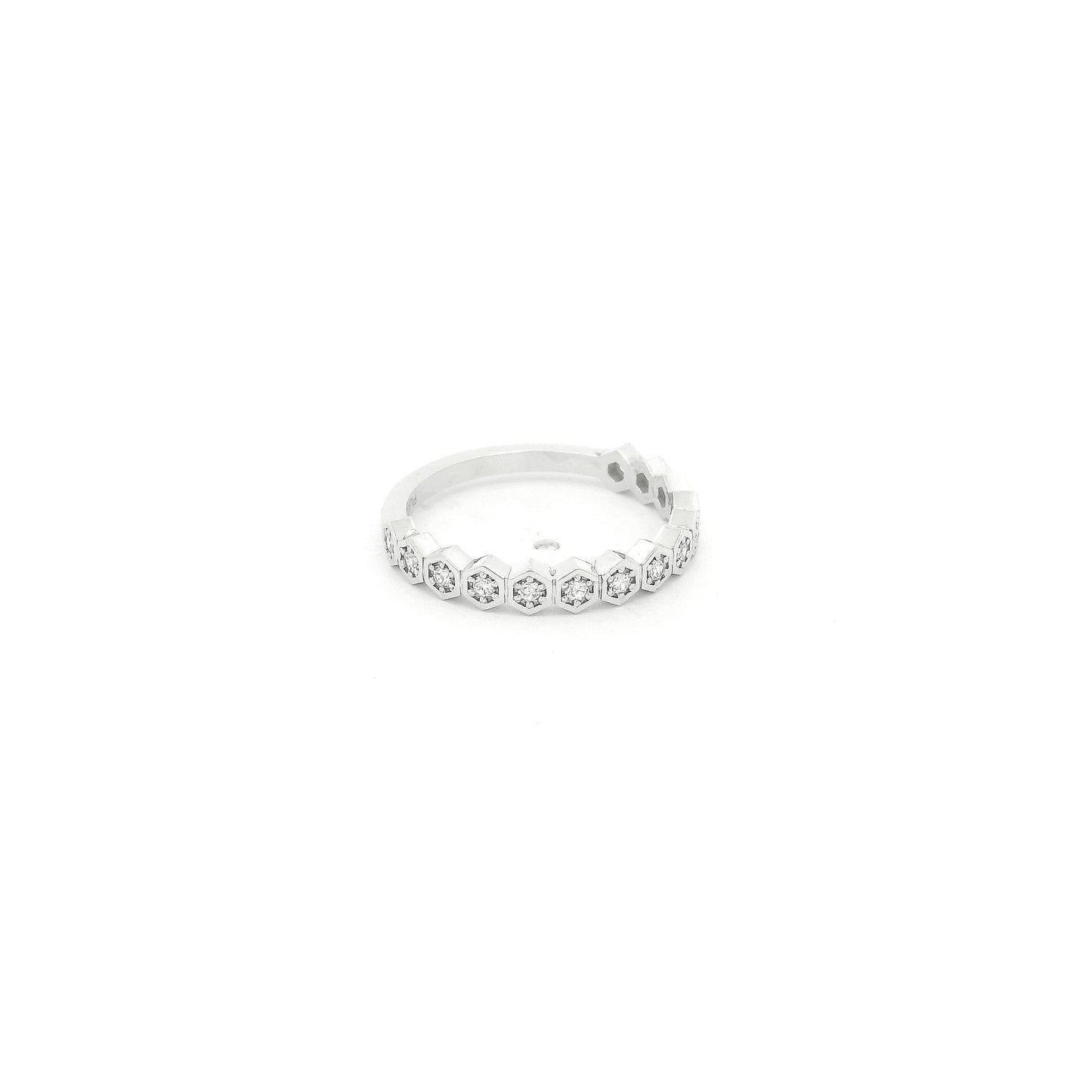 This custom platinum band features a striking row of octagon-shaped bezels, each framing a natural round brilliant cut diamond for a total of 0.18 carats of sparkle. Inspired by a matching design we carry in 14k yellow gold, this piece was custom crafted in platinum at the client’s request, giving the timeless silhouette a luxurious and enduring finish. The combination of geometric elegance, natural diamonds, and platinum’s exceptional durability makes this band a beautiful expression of personalized fine j