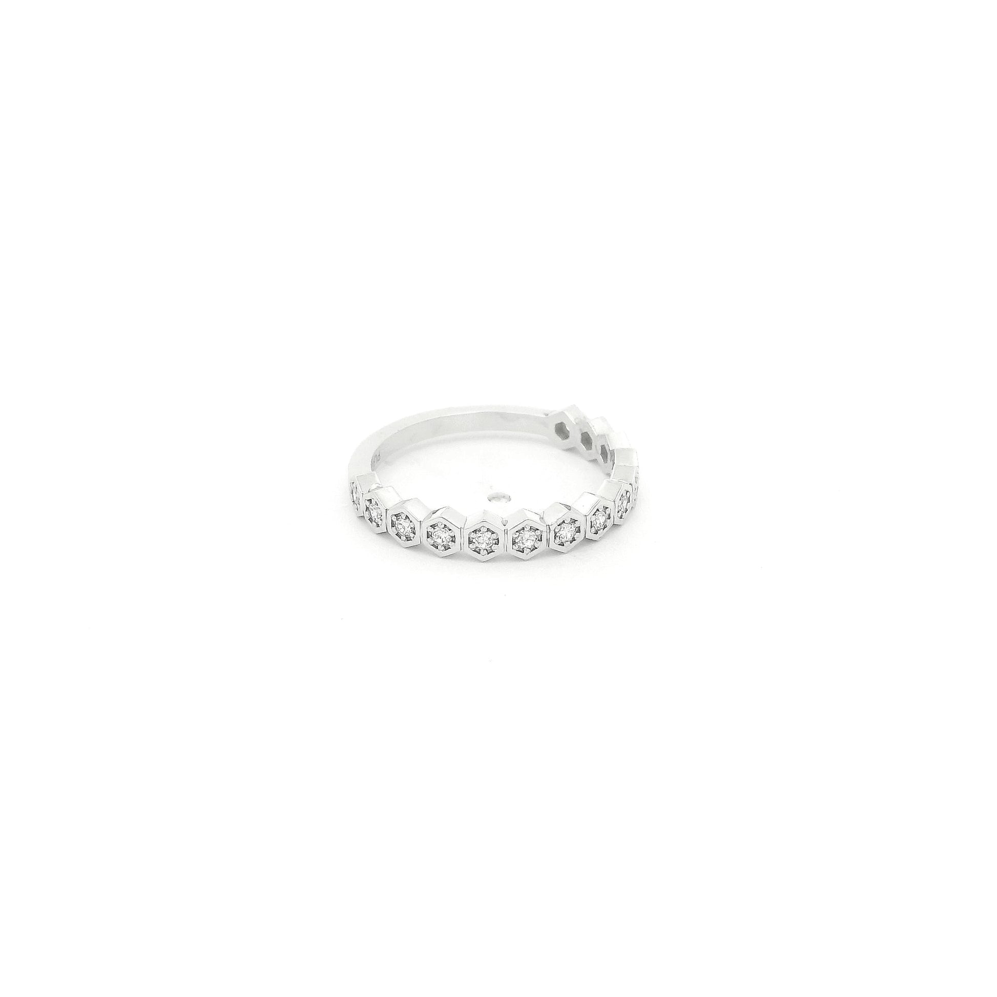 This custom platinum band features a striking row of octagon-shaped bezels, each framing a natural round brilliant cut diamond for a total of 0.18 carats of sparkle. Inspired by a matching design we carry in 14k yellow gold, this piece was custom crafted in platinum at the client’s request, giving the timeless silhouette a luxurious and enduring finish. The combination of geometric elegance, natural diamonds, and platinum’s exceptional durability makes this band a beautiful expression of personalized fine j