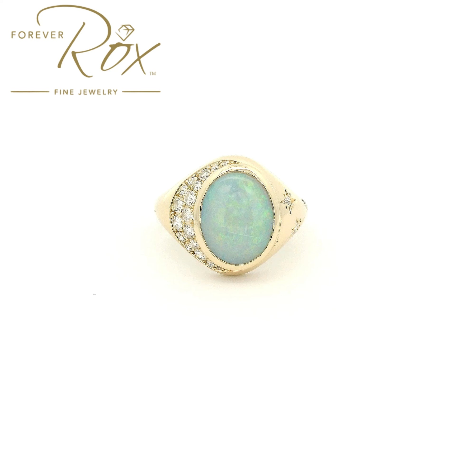 Custom 14k yellow gold oval opal ring with 0.24ctw diamond crescent moon and diamond star accents by Forever Rox Fine Jewelry, Lake Tahoes Best Jewelry Store