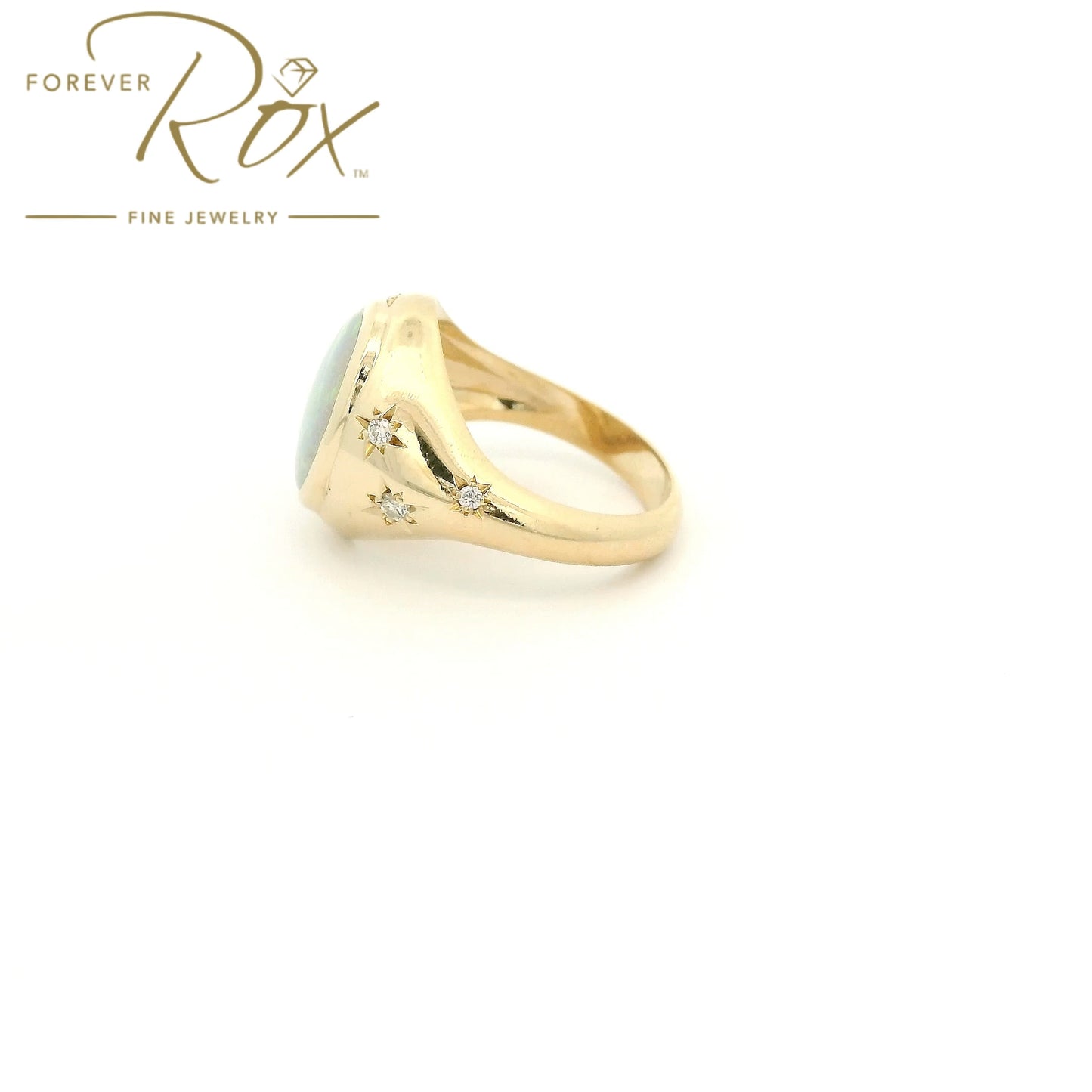 Custom 14k yellow gold oval opal ring with 0.24ctw diamond crescent moon and diamond star accents by Forever Rox Fine Jewelry, Lake Tahoes Best Jewelry Store