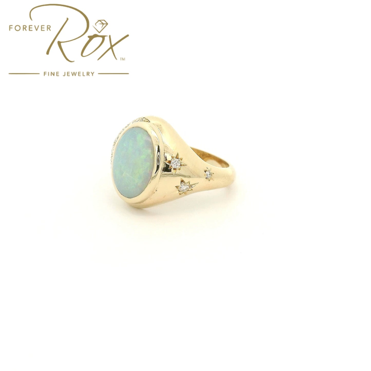Custom 14k yellow gold oval opal ring with 0.24ctw diamond crescent moon and diamond star accents by Forever Rox Fine Jewelry, Lake Tahoes Best Jewelry Store