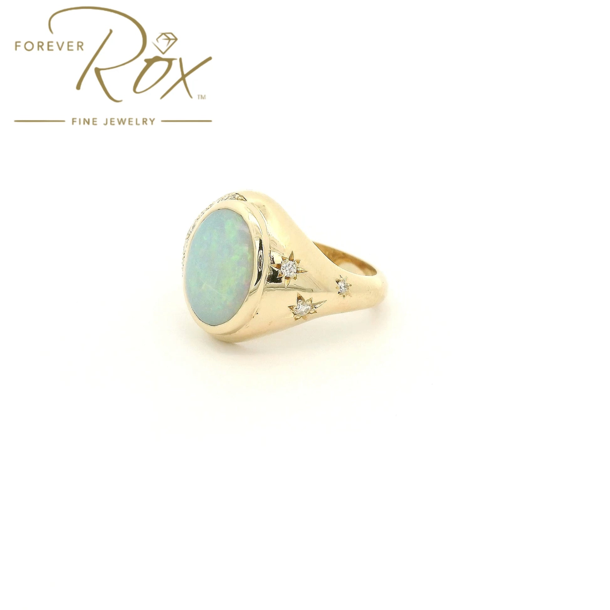 Custom 14k yellow gold oval opal ring with 0.24ctw diamond crescent moon and diamond star accents by Forever Rox Fine Jewelry, Lake Tahoes Best Jewelry Store