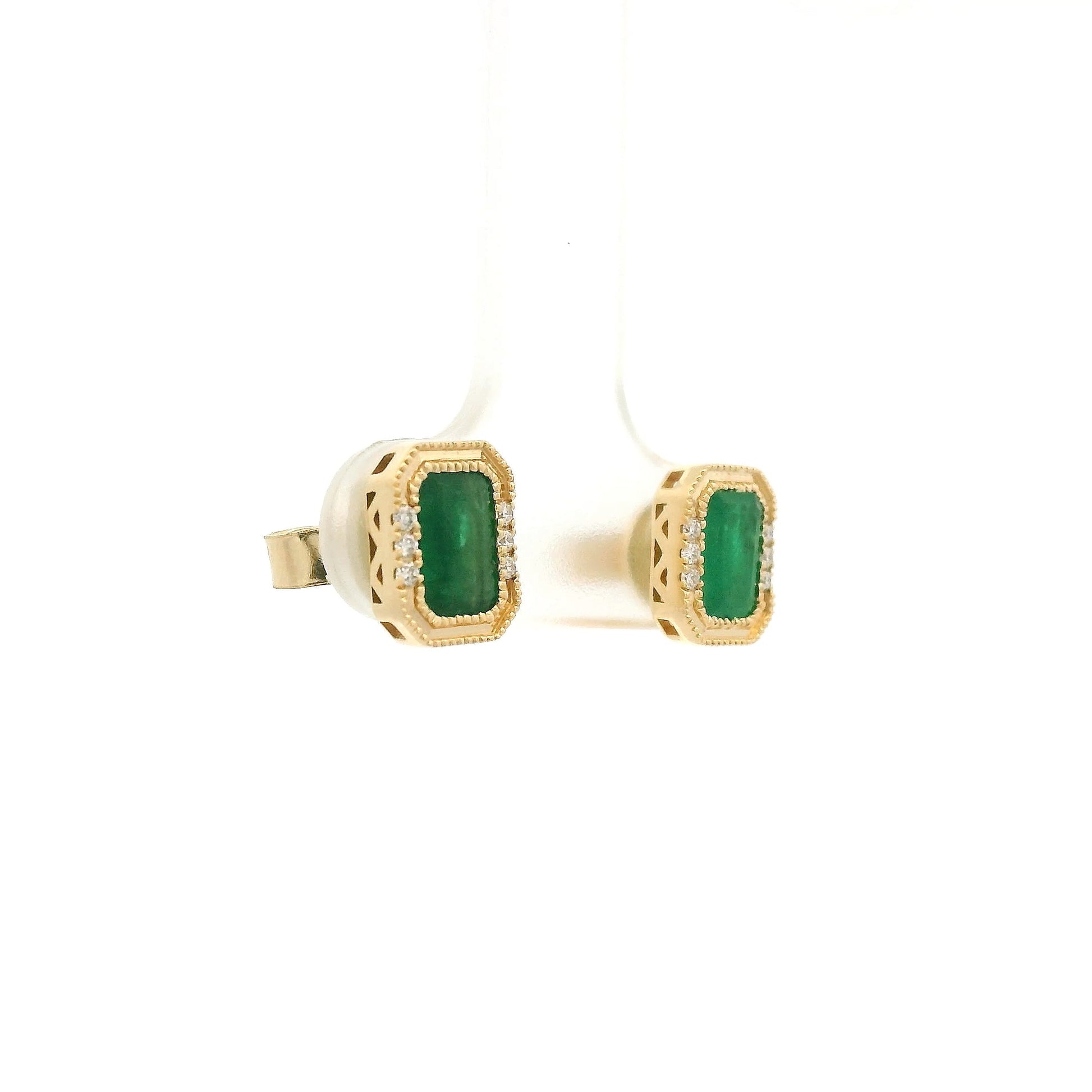 A Pair of Yellow Gold Earrings with a bezel set emerald cut natural Emerald in the center with a halo of diamonds at Forever Rox Fine Jewelry, Lake Tahoes Best Jewelry Store