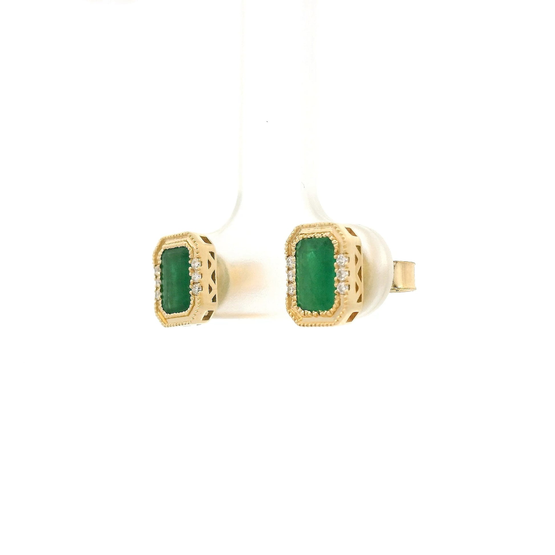 A Pair of Yellow Gold Earrings with a bezel set emerald cut natural Emerald in the center with a halo of diamonds at Forever Rox Fine Jewelry, Lake Tahoes Best Jewelry Store