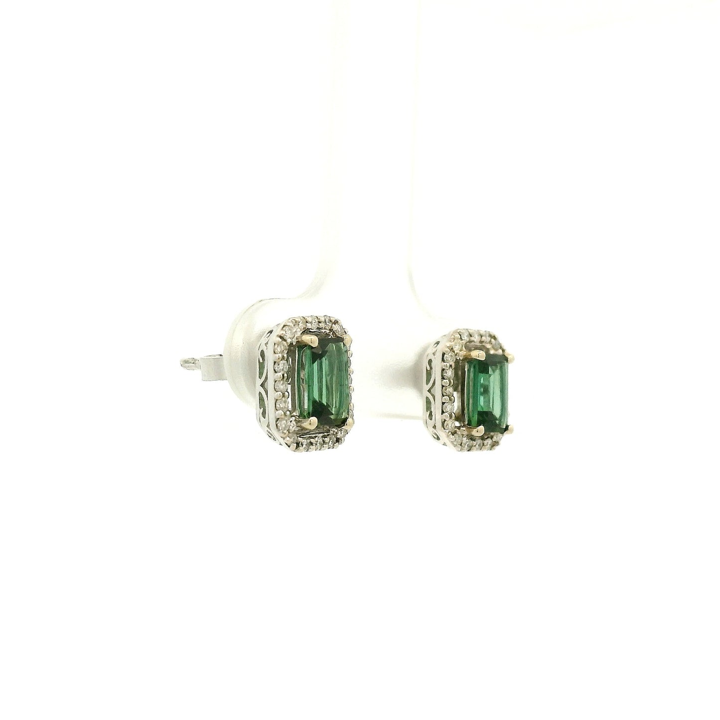 A Pair of White Gold Earrings with prong set emerald cut natural Green Tourmaline in the center with a diamond halo at Forever Rox Fine Jewelry, Lake Tahoes Best Jewelry Store