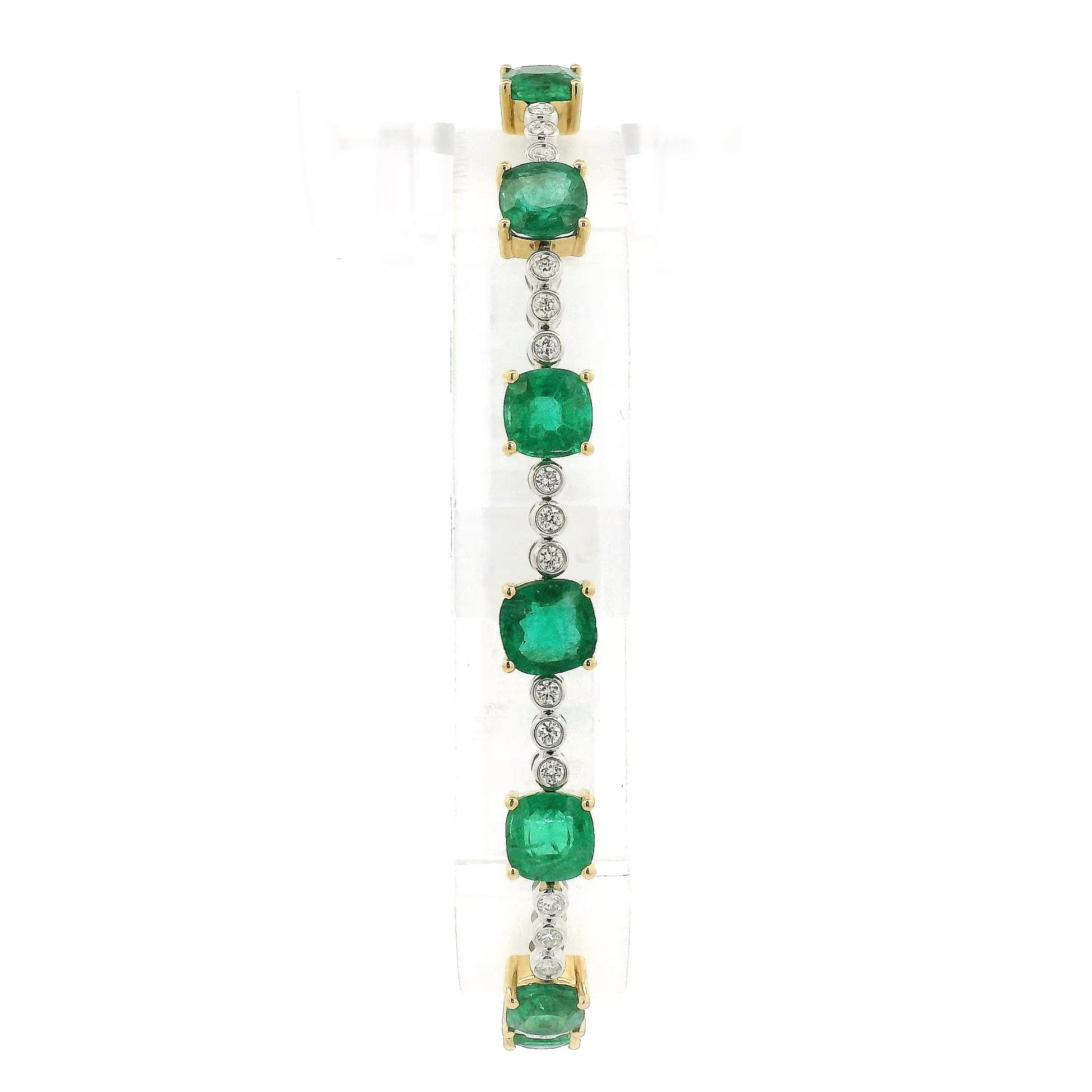 A Yellow Gold Tennis Bracelet with prong set cushion cut natural Emeralds alternating after every 3 natural bezel set diamonds at Forever Rox Fine Jewelry, Lake Tahoes Best Jewelry Store