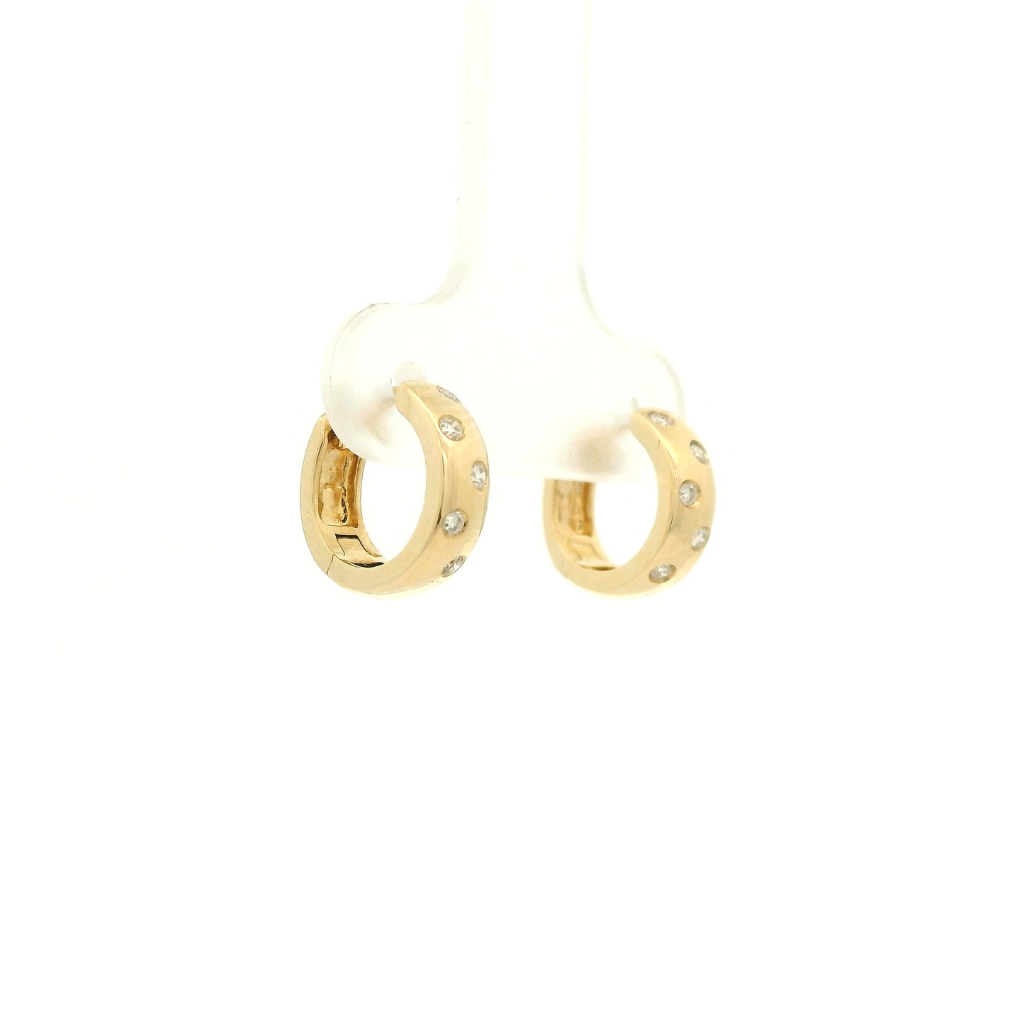 A Pair of Yellow Gold Hoop Earrings with flush set round cut natural Diamonds scattered in the gold at Forever Rox Fine Jewelry, Lake Tahoes Best Jewelry Store